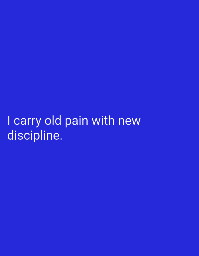 The image displays white text on a solid blue background. The text reads: "I carry old pain with new discipline." There are no people, objects, or any discernible environmental context, including any specific location in Lassan, Pakistan.