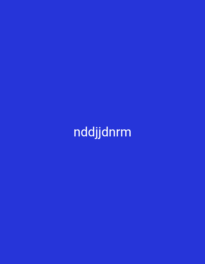 The image displays a solid blue background with the text "nddjjdnrm" centrally located and in white. There are no people, objects, or environmental features visible in the image. Therefore, it is impossible to determine the location in the city of Nsugpe, Nigeria, or to provide any forensic details about a scene.