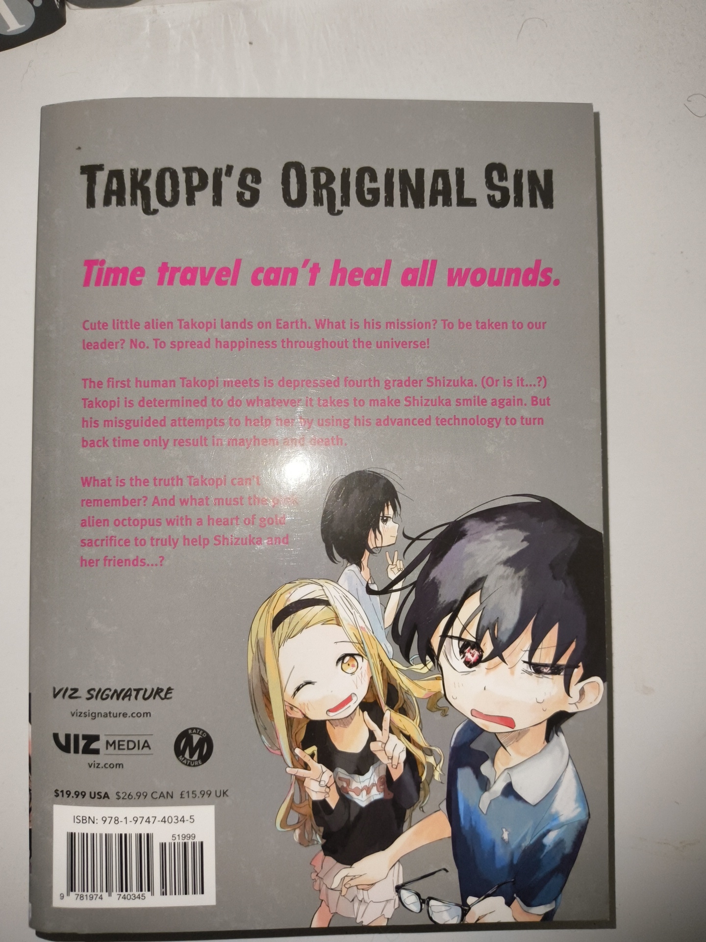 The image shows the back cover of the manga "Takopi's Original Sin." The cover features a grey background with the title and tagline printed in black and pink. A summary of the manga is provided, describing the story of an alien named Takopi who tries to help a depressed girl named Shizuka by using time travel technology, which leads to mayhem and death. The cover also features an illustration of Shizuka and other characters. The Viz Signature logo and other publishing information, including the ISBN, price, and website addresses, are printed at the bottom of the cover. There is no location of Sofia, Bulgaria included in the image.