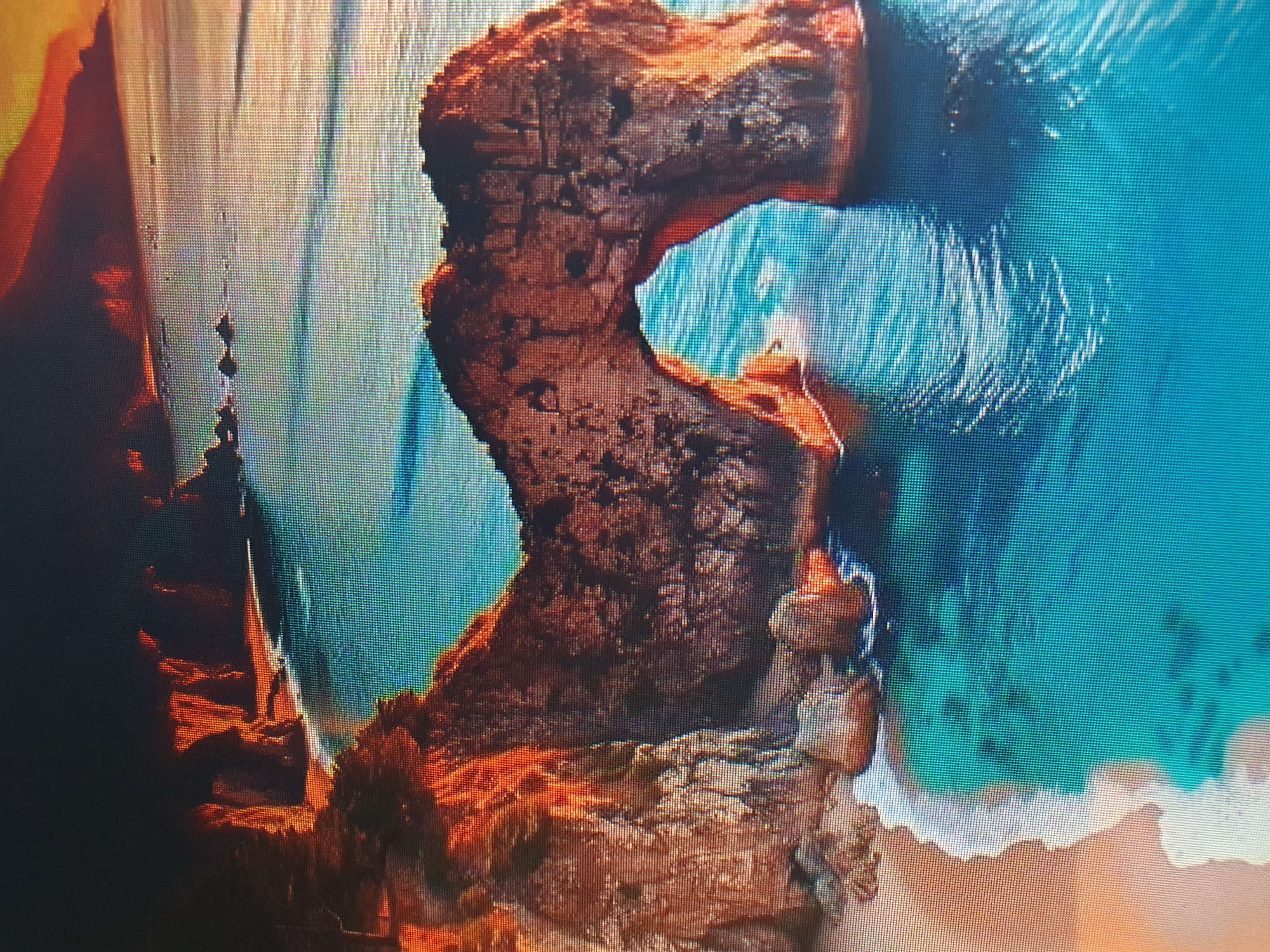 This is an aerial photograph of a rugged coastline featuring a natural rock arch formation spanning over the turquoise sea. The sun is low on the horizon, casting a warm, orange glow on the cliffs and the water. The sea is clear and calm, with gentle waves lapping at a sandy beach. The scene is devoid of people or any man-made structures, presenting a wild and untouched natural landscape. This image is not located in Tashkent, Uzbekistan, as Tashkent is an inland city and does not have a coastline.