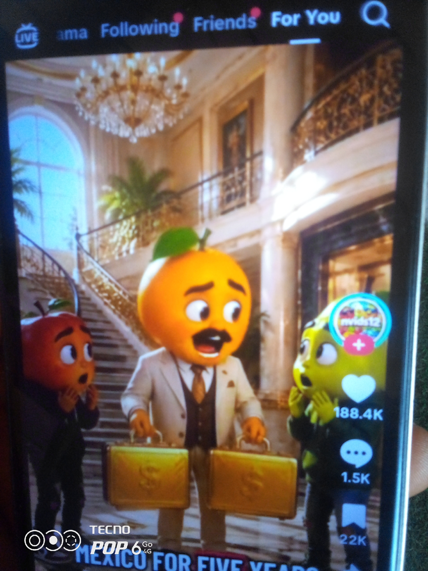 The image is a screenshot of a mobile device displaying a video, likely from a social media platform. The video features animated characters dressed in suits, resembling fruits, in what appears to be an opulent interior setting with grand staircases and a chandelier. One character, an orange, is centrally positioned, holding a briefcase. To its left, a red apple-like character looks surprised, and to its right, a green pear-like character also exhibits a startled expression. Overlayed on the video are interface elements typical of a video-sharing app, including icons for "Live," "Following," "Friends," and "For You," as well as engagement metrics like a heart icon with "188.4K" likes, a comment icon with "1.5K," and a share icon with "22K." At the bottom of the screen, branding for "TECNO POP 6 Go" and text "MEXICO FOR FIVE YEARS" are visible. The location is not specified as Howayi, Nigeria.