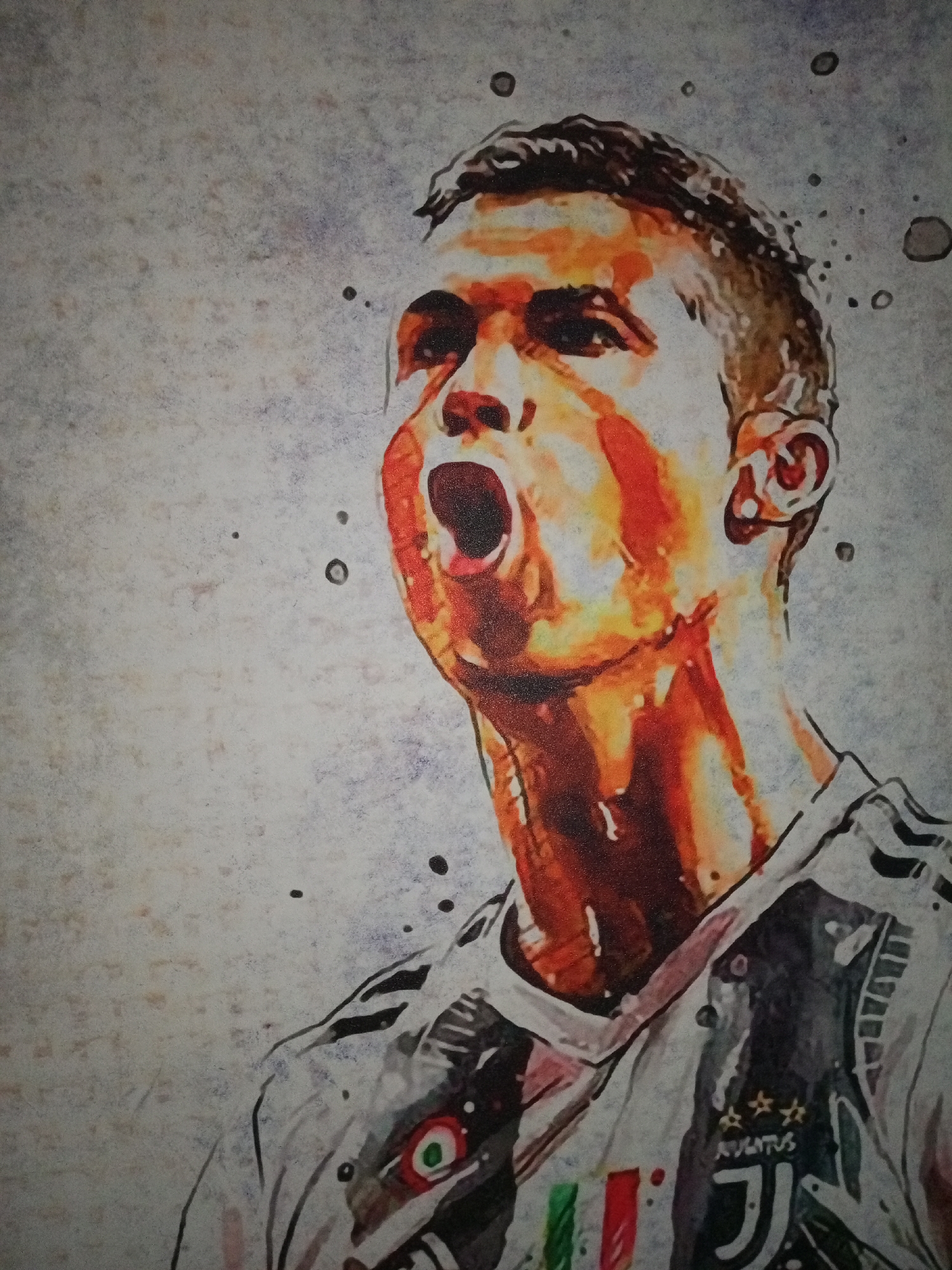 The image is a watercolor-style portrait of Cristiano Ronaldo, depicted in a Juventus jersey. He is shown with his mouth open, possibly yelling or celebrating. The jersey features the Juventus logo. The background is a mottled, light gray color with dark splatters. There is no evidence suggesting a location in the city of Уральское, Russia.