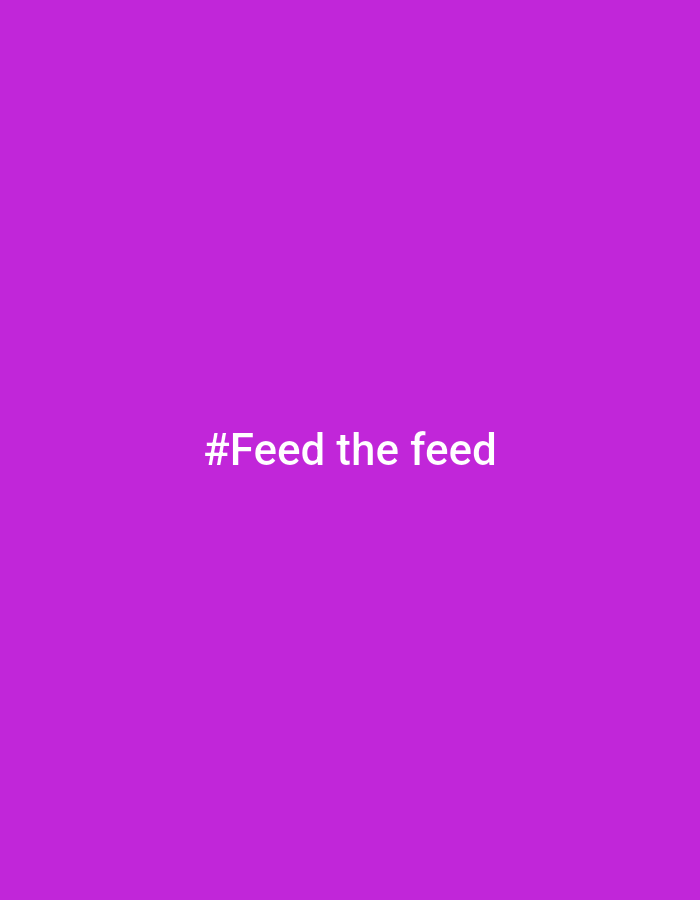 This is a media file featuring a plain, solid purple background. Centered on the background, in white text, is the hashtag "#Feed the feed". There are no people, objects, or scenes depicted, and therefore no activities or events taking place. The image is a simple graphic with text overlay. There are no discernible details regarding time of day, weather, location cues, or emotions, as the image is purely text on a colored background. The only textual content is the hashtag itself.