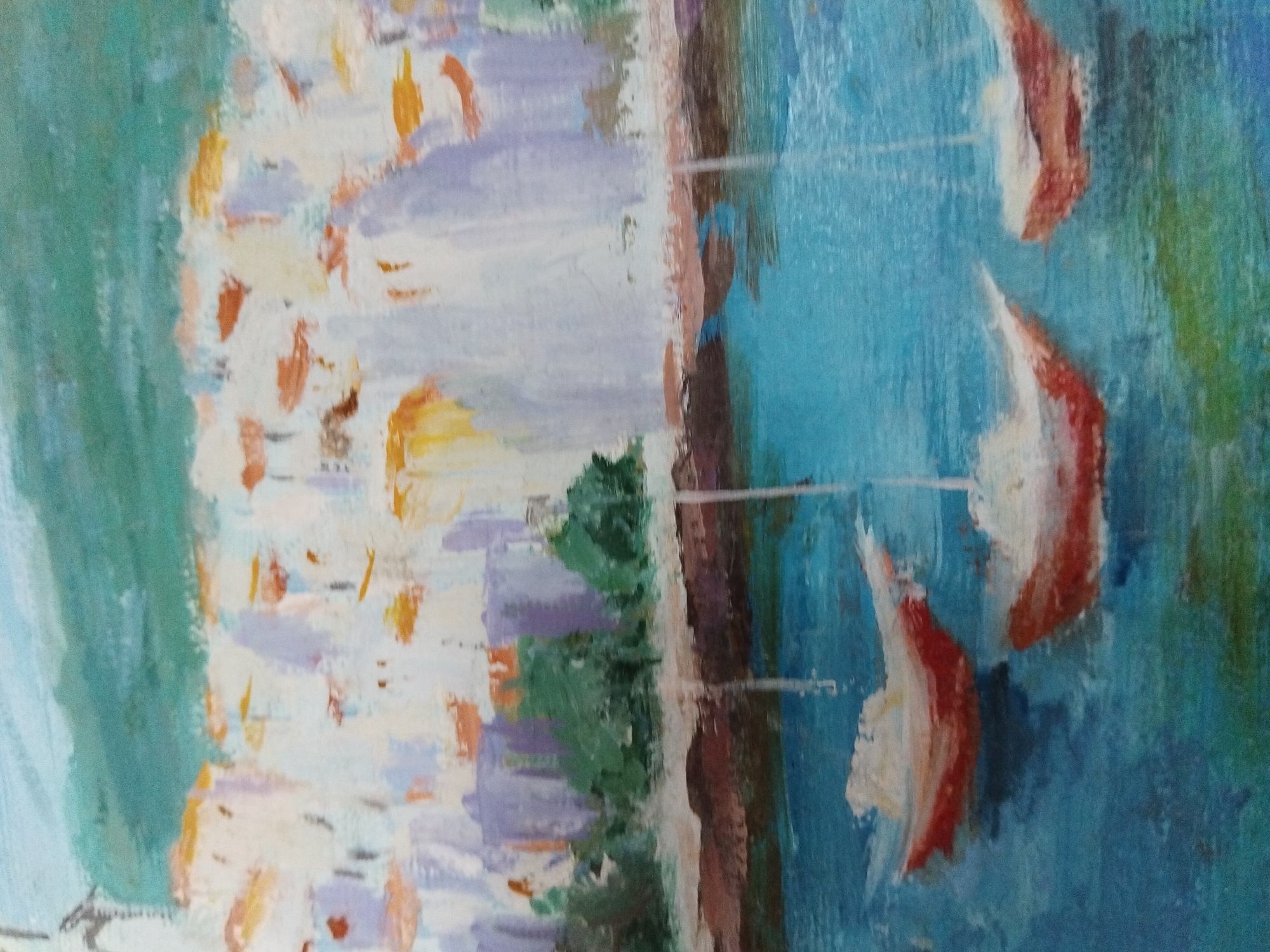 This is an impressionistic oil painting depicting a waterfront scene with boats and buildings. In the foreground, three sailboats with red and white hulls are floating on a vibrant blue body of water. The water has reflections of the boats and some greenish areas. Behind the water, there is a shoreline with a reddish-brown band, followed by a row of lush green trees. Above the trees, a cluster of buildings with white and pastel-colored facades is visible, suggesting a town or city. The sky above is a light blue with hints of green. The style is loose and painterly, with visible brushstrokes. There are no people visible in the painting. The painting does not provide any specific clues or context to suggest it is located in Kyiv, Ukraine.