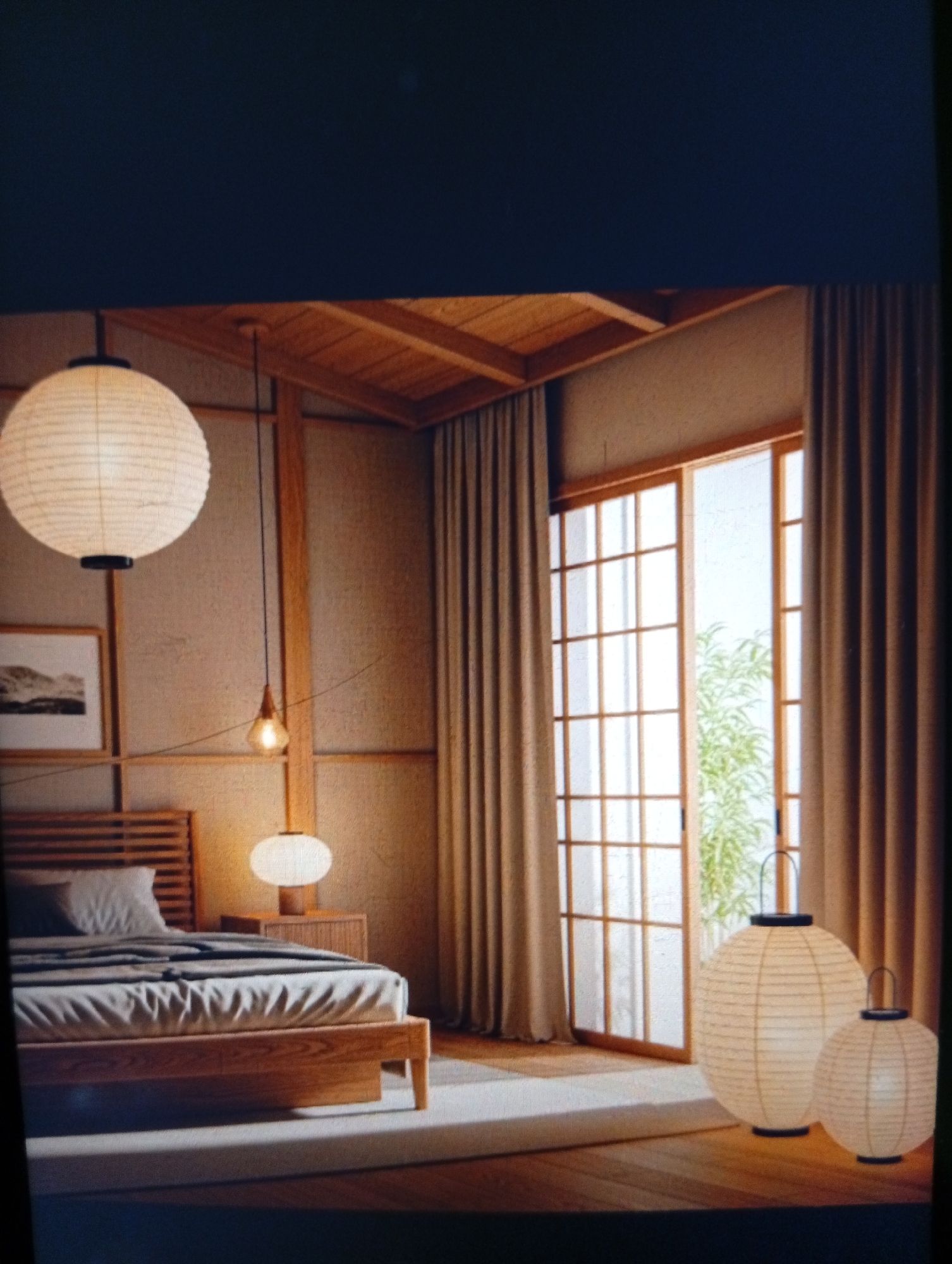 The image depicts a bedroom in an Asian-inspired style. The walls are a neutral tone, with wooden beams accentuating the structure. A large, round paper lantern hangs from the ceiling above a wooden bed with gray bedding. Beside the bed, there is a wooden nightstand with a smaller round lamp. Floor-to-ceiling windows with a grid-like design provide natural light, with beige curtains framing the window. Outside, greenery is visible. On the floor, there are two paper lanterns of varying sizes, providing ambient light. The flooring appears to be wooden. The image does not show any evidence of the location being Dutsen Alhaji, Nigeria.