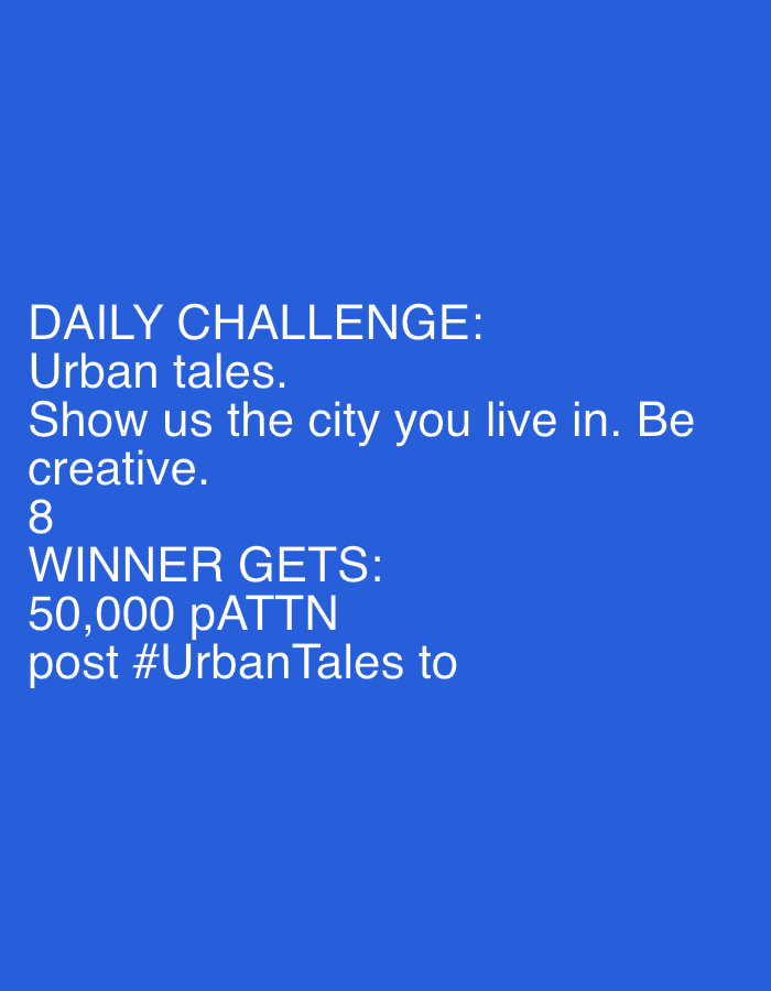 The image is a digital graphic with white text on a solid blue background. The text reads "DAILY CHALLENGE: Urban tales. Show us the city you live in. Be creative. 8 WINNER GETS: 50,000 pATTN post #UrbanTales to". The text is left-aligned and appears to be a promotional announcement for a creative challenge. There are no discernible elements in the image related to the city of Yizhivtsi, Ukraine, or any people, subjects, objects, actions, or interactions. The image is purely typographic.