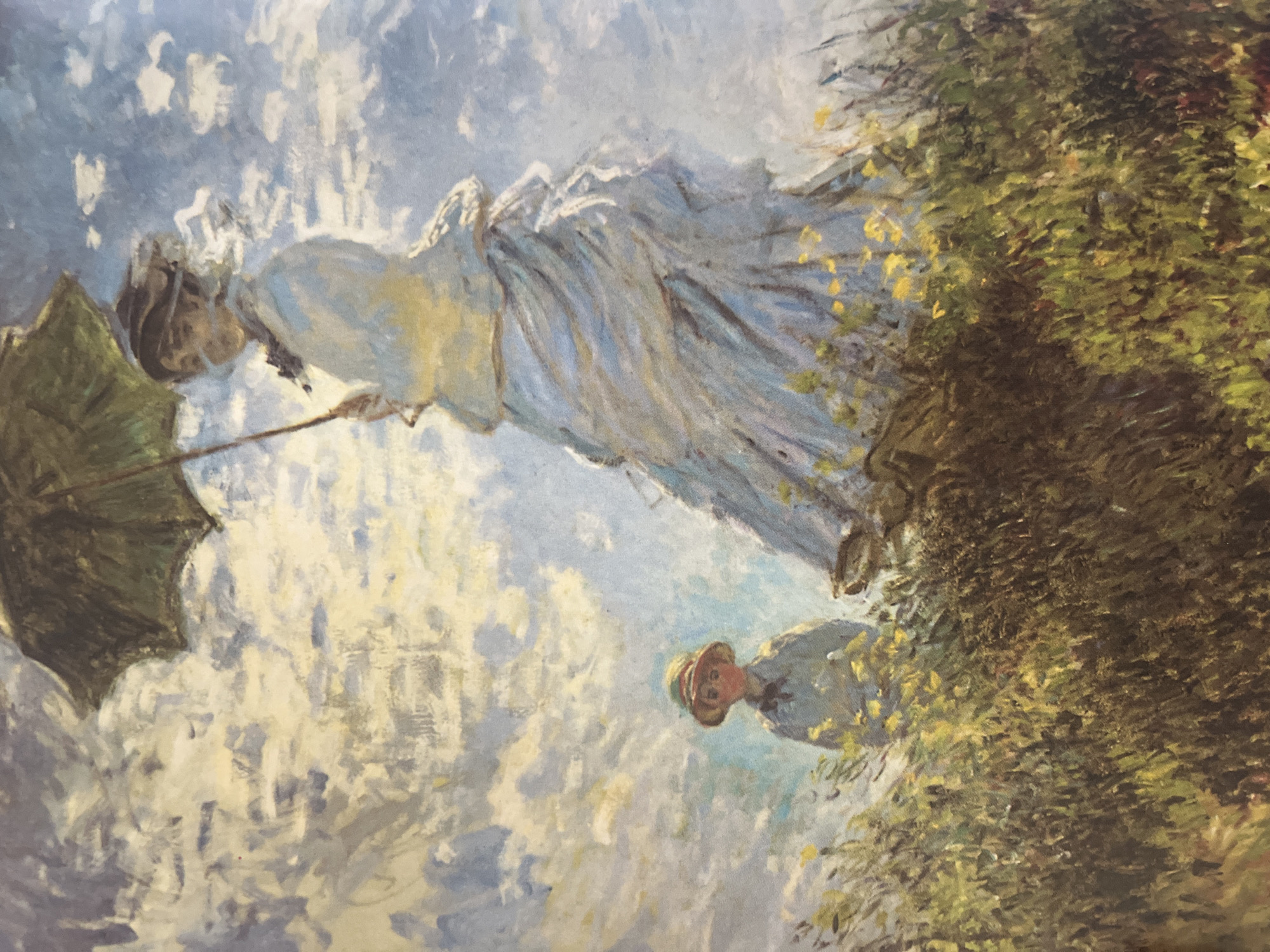 The image is an Impressionist painting featuring a woman with an umbrella. She wears a light-colored dress and is positioned on a grassy area, possibly a hilltop. A man in a hat stands nearby. The background consists of a light blue and white sky with suggestive brushstrokes. There's no visible information to ascertain the location as the city of Varna, Bulgaria. The artwork appears to be in the style of Claude Monet's "Woman with a Parasol - Madame Monet and Her Son".