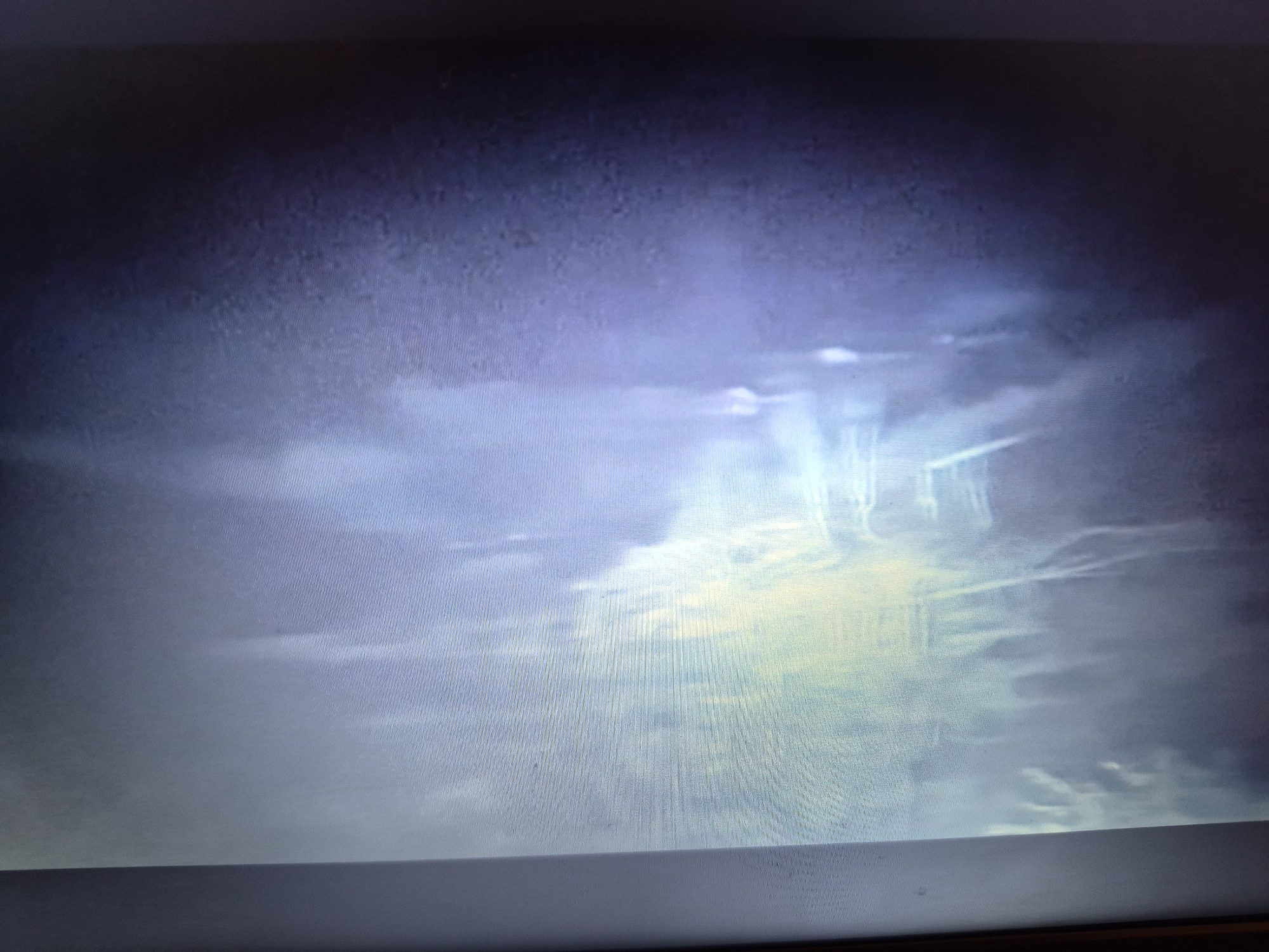 The image shows a dark, grainy, and distorted view of what appears to be a bright light shining through clouds or mist. There are no discernible people, subjects, or objects. The image quality is poor, making it difficult to identify any specific details. It is not possible to determine the location in Sandwell, United Kingdom, or any other specific location from this image.