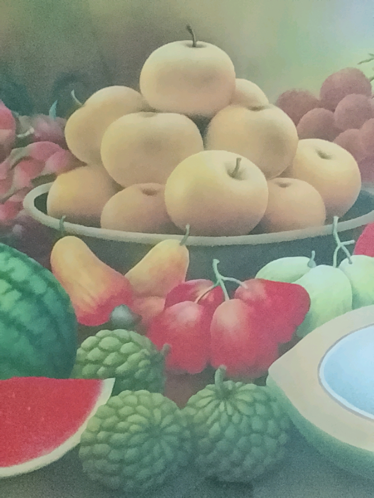 This is a painting of a fruit display. In the foreground, there is a slice of watermelon with its red flesh and white rind visible. To the right of the watermelon slice are two green, bumpy fruits, possibly soursop or custard apples. Behind these, a halved coconut with its white flesh and brown husk is visible. In the middle ground, a variety of fruits are arranged. These include red, bell-shaped fruits, possibly rose apples or bell peppers, and lighter green fruits that could be grapes or other small berries. A large, dark green, striped fruit, likely a watermelon, is on the left side. Above these, a large bowl or basket contains numerous round, pale yellow fruits, resembling apples or pears, piled high. In the background, a cluster of reddish-purple grapes is visible. The painting has a soft, blended style with a muted color palette. There is no indication of the city of Kalibeji, Indonesia, or any specific location within it. The image depicts an arrangement of various fruits, likely intended as a still life.