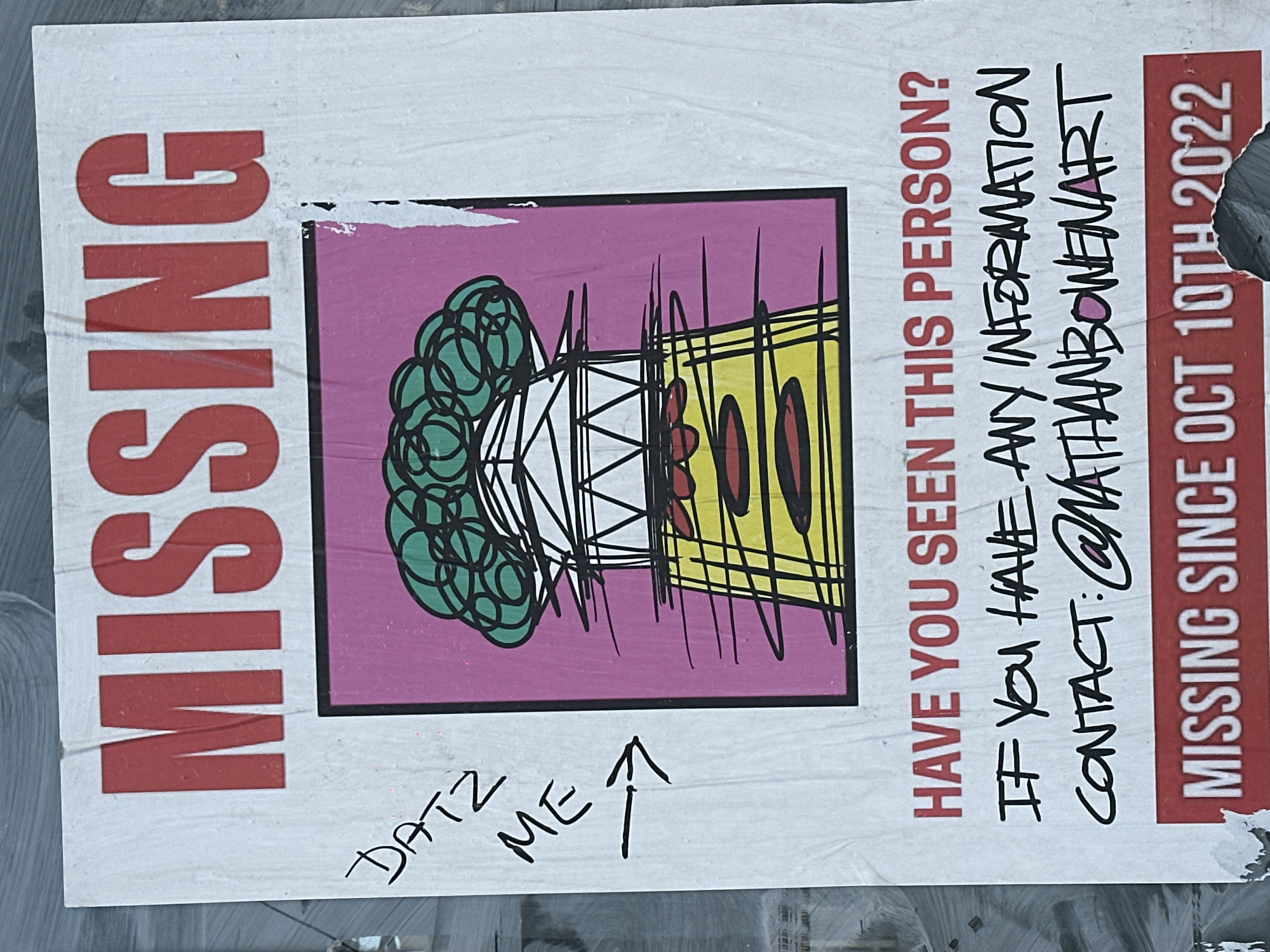 A "MISSING" poster is affixed to a textured grey surface in London, United Kingdom. The poster features the word "MISSING" prominently in red capital letters at the top. Below this, a stylized cartoon drawing depicts a green, broccoli-like canopy atop a white, triangulated structure, which in turn rests on a yellow, striped base with red oval details, set against a solid magenta background. This drawing strongly resembles 30 St Mary Axe, known as The Gherkin. To the left of this image, handwritten in black ink, are the words "DATZ ME" followed by an arrow pointing directly to the drawn structure. Below the image, red text asks, "HAVE YOU SEEN THIS PERSON?". Further down, handwritten black text states, "IF YOU HAVE ANY INFORMATION CONTACT: @NATHANBOWENART". A red banner at the bottom contains the text "MISSING SINCE OCT 10TH 2022". The poster exhibits minor creasing and some tearing, particularly along the right edge of the central image and at the bottom.