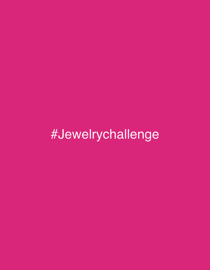 The image displays a solid magenta background. Centered horizontally, and slightly below the vertical midline, white sans-serif text reads "#Jewelrychallenge". No people, physical objects, actions, interactions, or discernible environment are present. A specific location in the city of London, United Kingdom, cannot be determined from the image content.