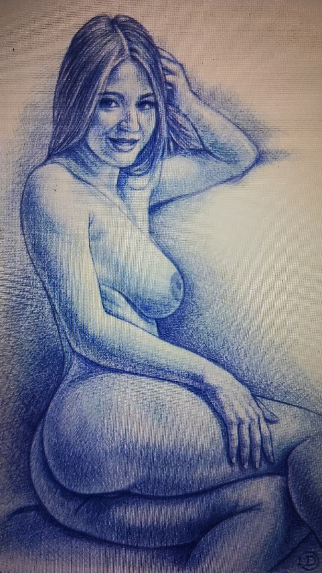This is a pencil sketch of a woman. The woman is depicted from the chest up, reclining and looking towards the viewer. She has long, dark hair that is styled loosely around her shoulders. Her left arm is bent, with her hand resting on her head. Her right arm is also bent, with her hand resting on her thigh. She is smiling slightly. The background is textured, suggesting a soft surface or a shaded environment. There are no specific details in the image that would allow for the identification of a location in Sochi, Russia.