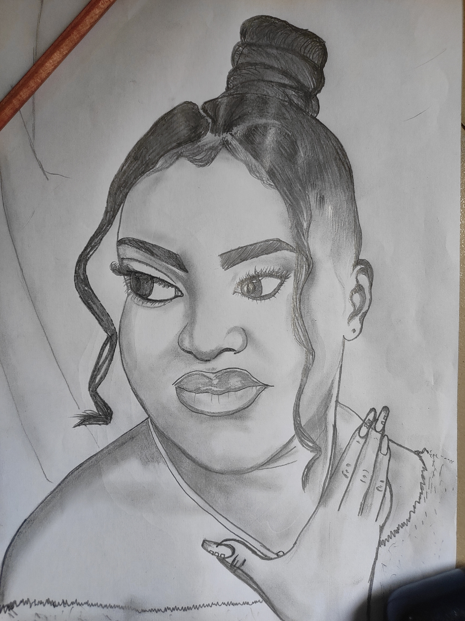 A sketch depicts a woman with dark hair styled in a high bun. The hair has loose strands framing her face. She is gazing to the left. Her facial features include defined eyebrows, full lips, and visible eyelashes. She has a hand near her face. The drawing is shaded, creating highlights and shadows. A pencil is visible in the upper left corner of the image. The location of Abuja, Nigeria, is not apparent in the visual information.