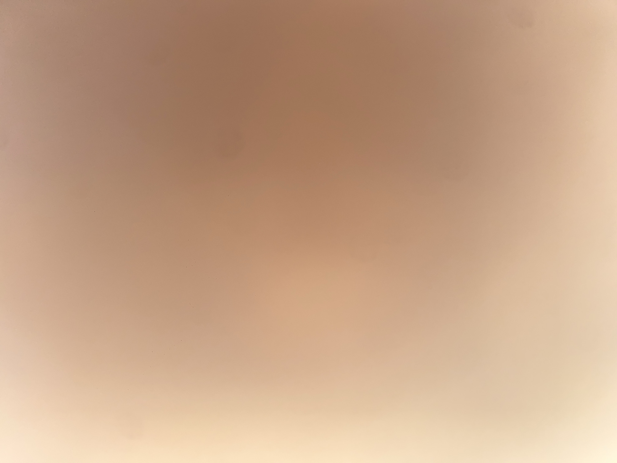 The image shows a blurred, light brown and peach-toned background with some faint dark spots. There are no discernible objects, people, or actions. The scene does not provide any visual information related to the city of Ablanitsa, Bulgaria.