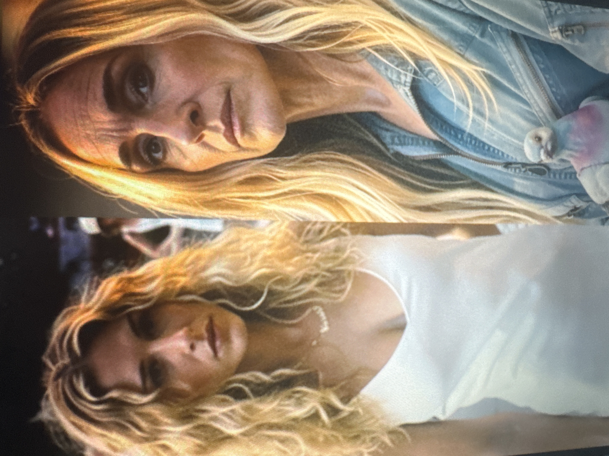 The image is a split screen showing two women. The woman on the left is younger with long, curly blonde hair and is wearing a white tank top and a necklace. She is looking directly at the camera with a serious expression. The woman on the right is older, also with long blonde hair. She is wearing a denim jacket and holding a small bird with pink and blue markings. Her expression is also serious. The background for both images is blurred, but appears to be outdoors. There is no indication of the location being Protasovo, Russia.