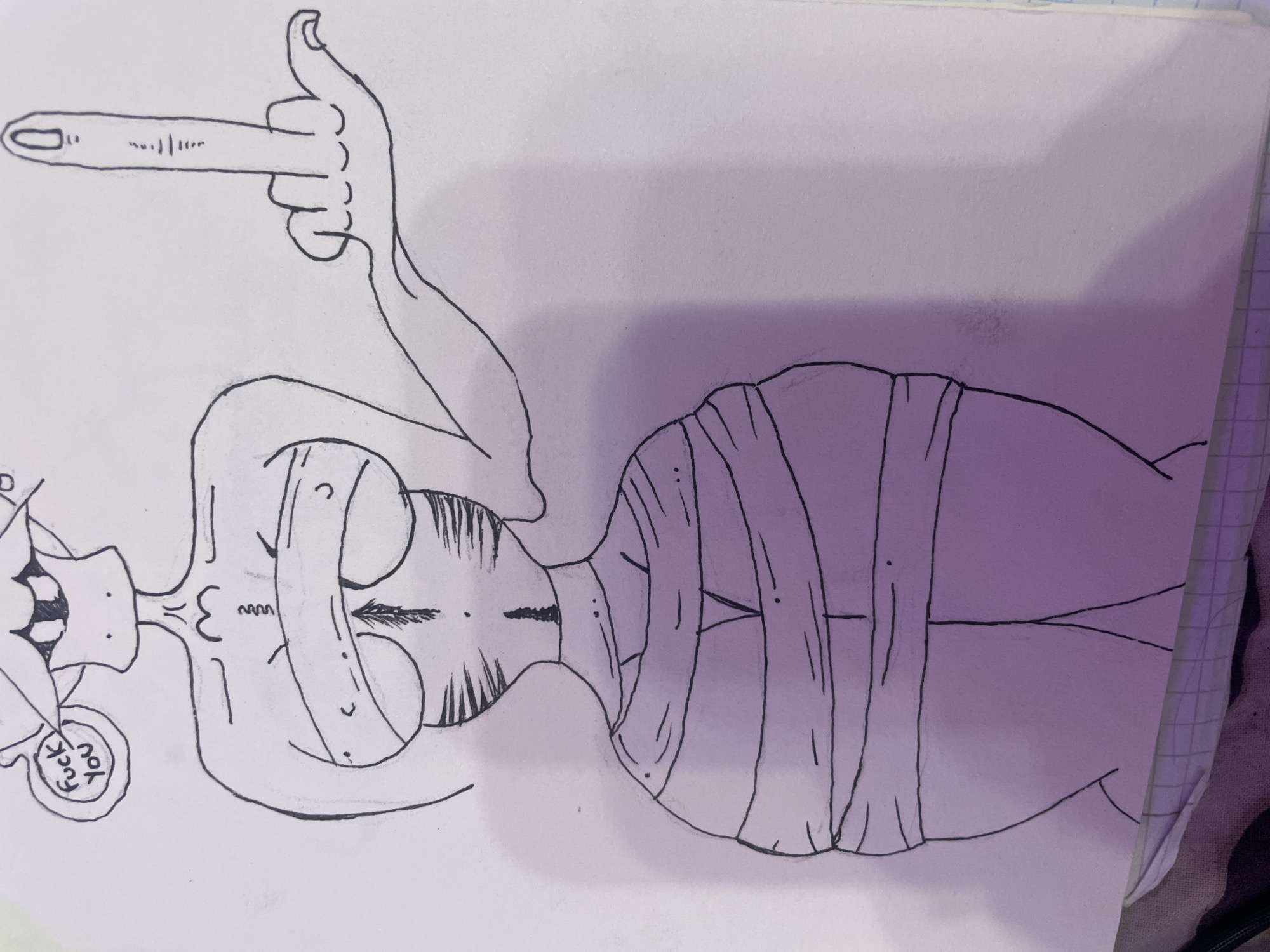 The image is a black and white line drawing on paper of a stylized figure. The figure is depicted from the torso up, with its body wrapped in bandages. The figure has a thin neck and torso, with prominent breasts. Its head is abstract, with a wide mouth and visible teeth, and a speech bubble above it contains the text "fuck you". The figure's right arm is extended, and its middle finger is raised in an offensive gesture. The background is plain white. There is a hint of a purple gradient on the lower part of the drawing, likely from lighting. The drawing is done on what appears to be a piece of notebook paper, with a grid pattern visible at the bottom.