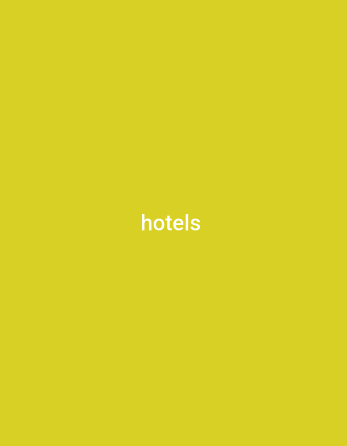 The image is a solid, bright yellow background with the word "hotels" written in white text in the center. There are no people, objects, actions, or interactions visible. The location in the city of Wuro Sani, Nigeria, is irrelevant to the content of the image.