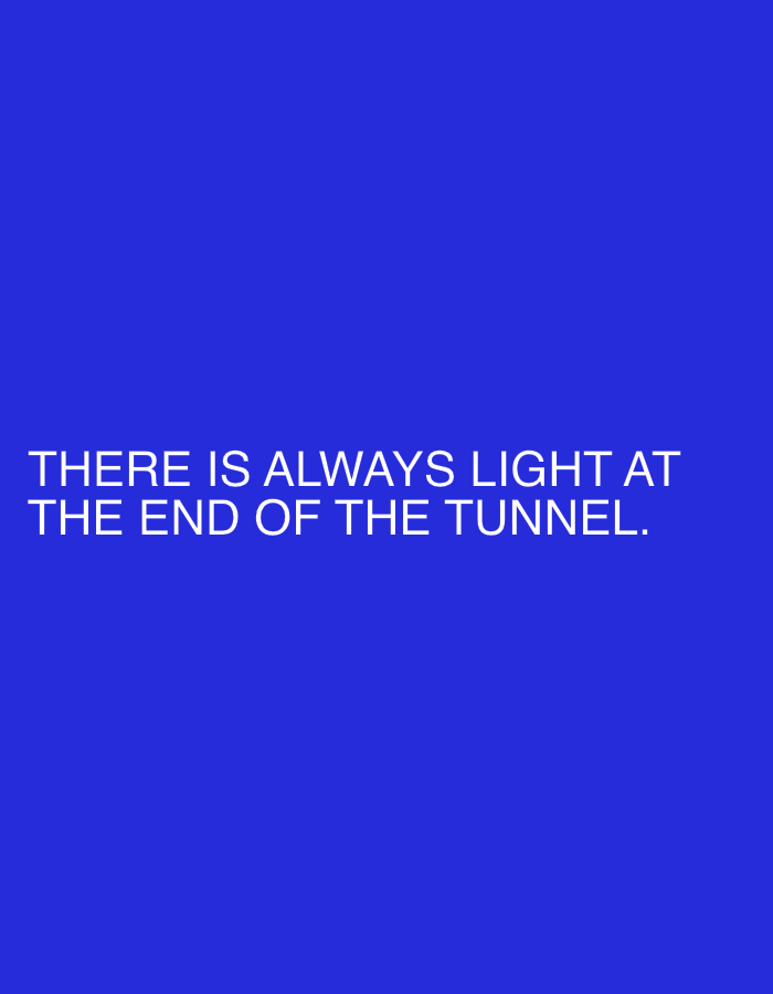 A blue background with the text "THERE IS ALWAYS LIGHT AT THE END OF THE TUNNEL." in white.