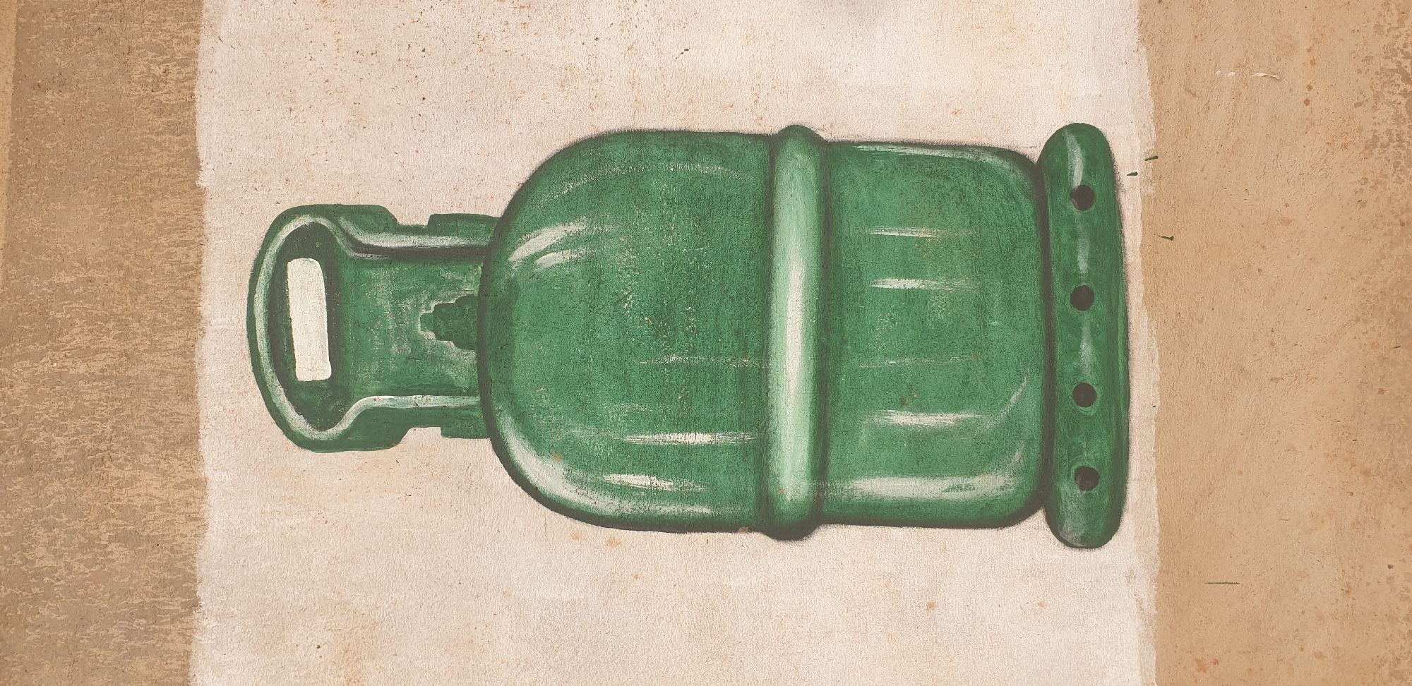 The image shows a painting of a green propane gas cylinder on a textured, light-colored wall. The cylinder is centrally located, with a handle at the top. The painting is rendered in a somewhat naive or folk art style, with visible brushstrokes and shading. The wall appears to be outdoors, possibly part of a building's exterior, as evidenced by the rough texture and the presence of a darker band of color along the bottom edge, suggesting a foundational element or a contrasting paint job. The overall impression is of a mural or decorative painting. This image is located in Yelwa, Nigeria.