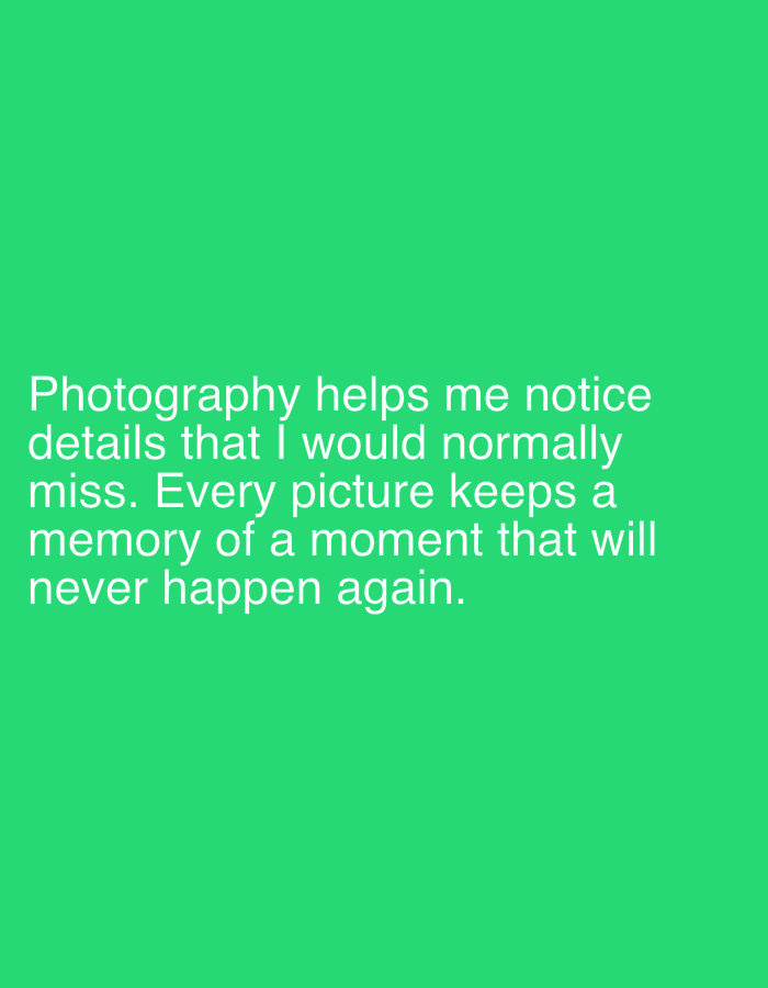 The image is a close-up of white text on a bright green background. The text reads: "Photography helps me notice details that I would normally miss. Every picture keeps a memory of a moment that will never happen again." There are no people, objects, or environmental features visible in the image, and no location in Lymanka, Ukraine is specified.