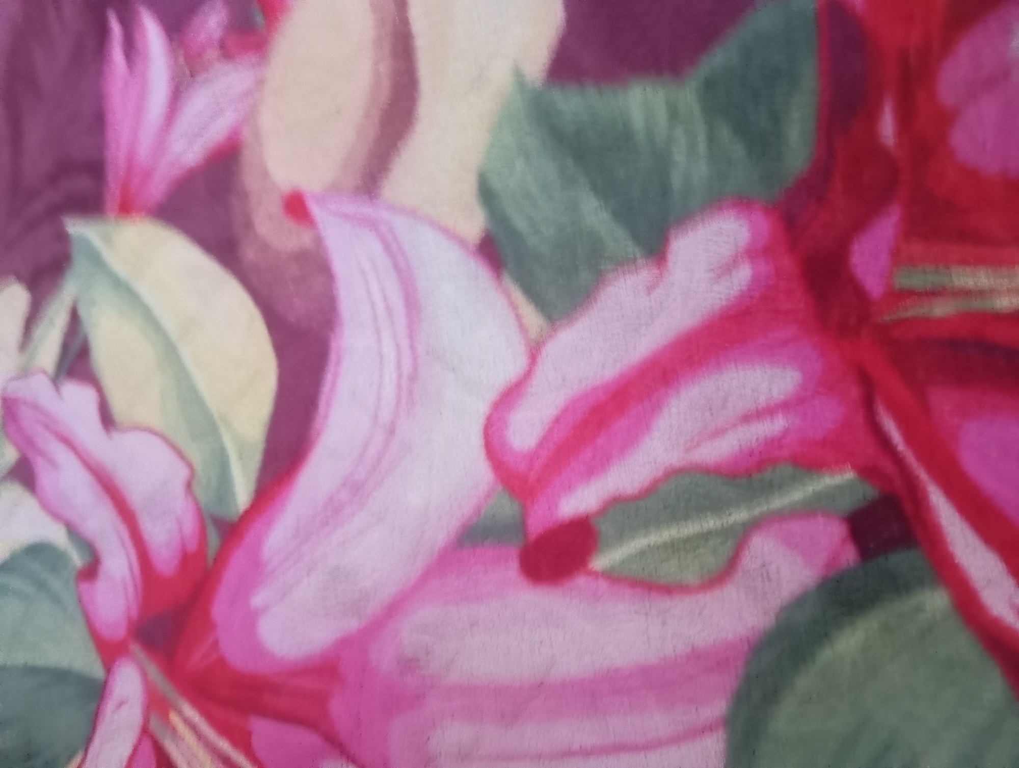 The image displays a close-up, abstract view of a floral pattern, likely on fabric. The dominant colors are various shades of pink, fuchsia, and green, with some muted yellow and deep plum tones. The pattern features stylized flower petals and leaves with soft, blended edges, giving the impression of a watercolor or painted design. There are no discernible people, objects, actions, interactions, or environmental details that would suggest a specific location in Rejosari, Indonesia, or any other place. The image is purely a decorative textile design.