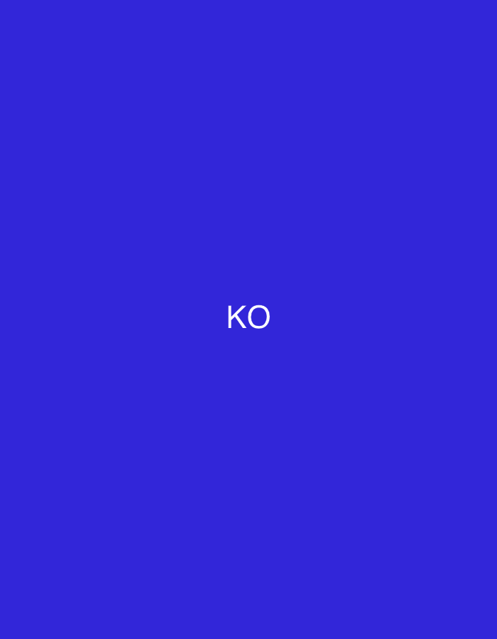 This digital display, observed in the city of Casablanca, Morocco, features a uniformly saturated blue background. Centered horizontally and vertically on this field are the two capital letters "KO" rendered in a plain white, sans-serif typeface. There are no other discernible objects, people, actions, or environmental details present within the frame, presenting a singular, static graphical element.