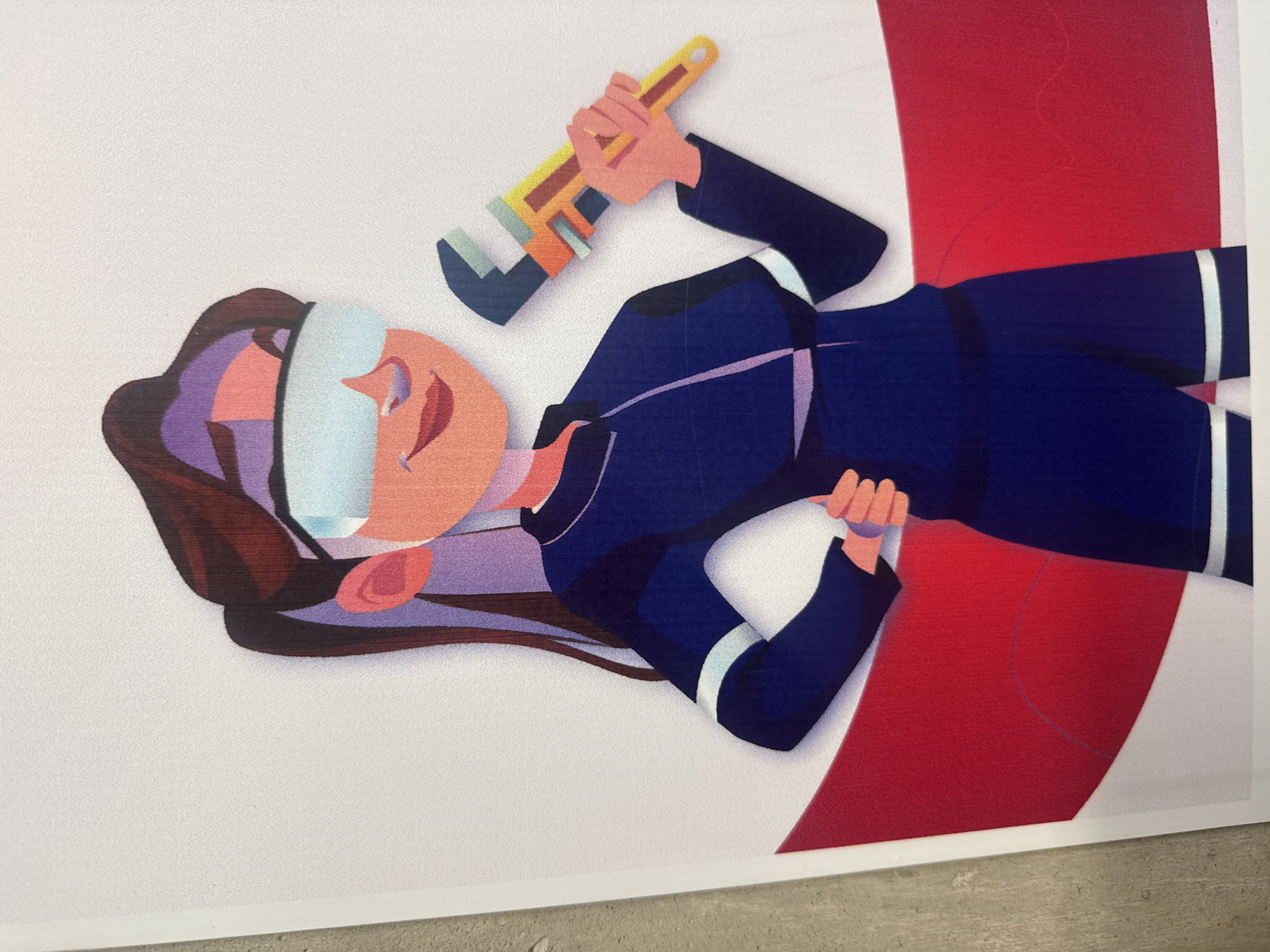 A digital illustration depicts a smiling woman holding a wrench. She is wearing a dark blue uniform with white accents, and her hair is dark brown and purple. The woman's face is peach-colored with stylized features, and she has a white bandage or visor over her eyes. A large red and white shape is positioned behind her, possibly representing a building or structure. The image is a print or poster. San Andrés Cholula, Mexico, is not visually represented or discernible in the image itself.