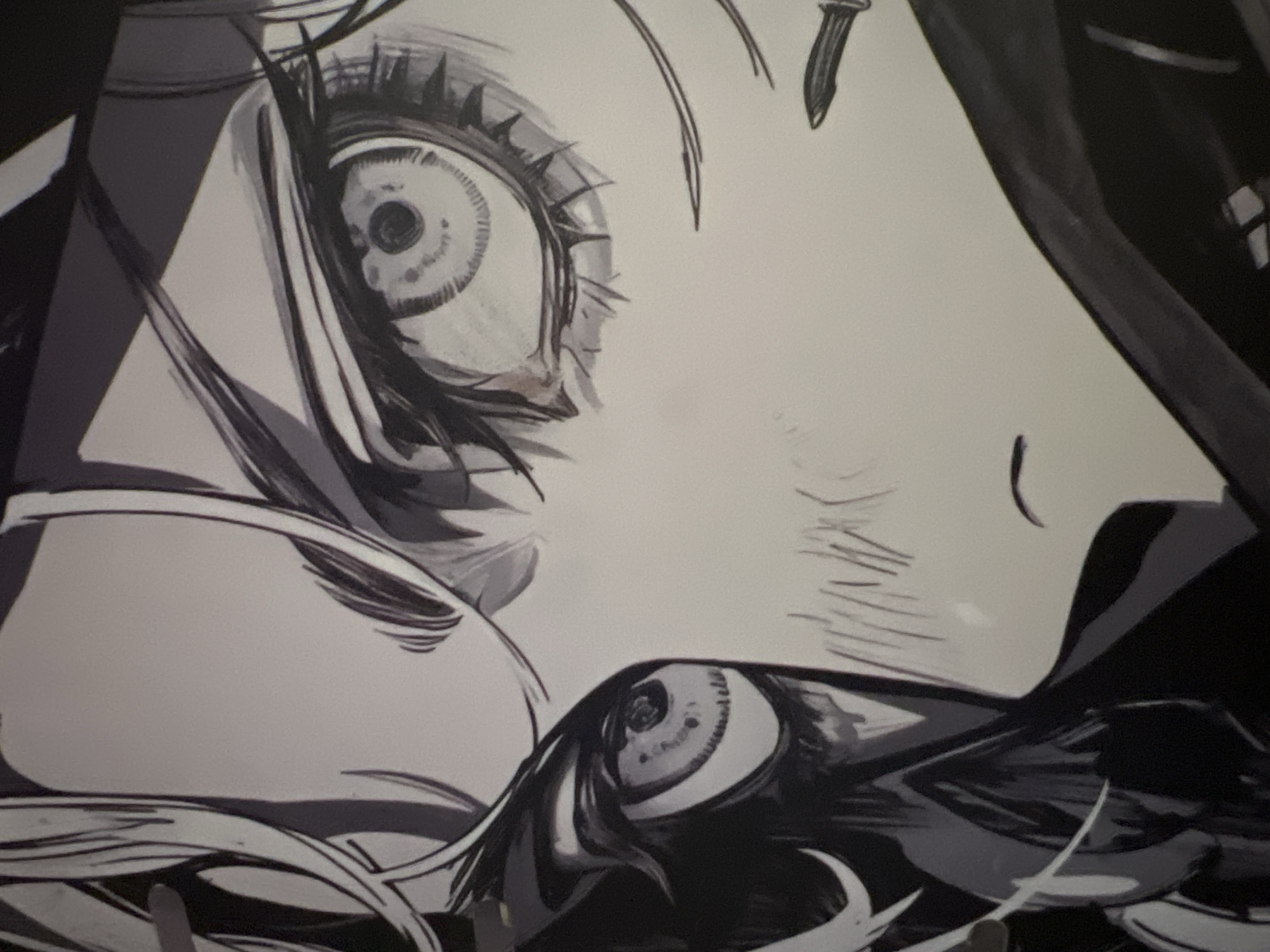 The image is a close-up, black and white illustration of a person's face, focusing on their eyes. The style is illustrative, with bold lines and dramatic shading, characteristic of anime or manga. The person has large, expressive eyes with intricate details in the irises and eyelashes. There are visible brushstrokes and ink work. The left eye is partially obscured by dark hair and shadow, while the right eye is more fully visible. The overall tone is intense and potentially conveys a strong emotion. The image does not contain any information that would allow for localization to Minsk, Belarus, or any other specific geographical location within a city.