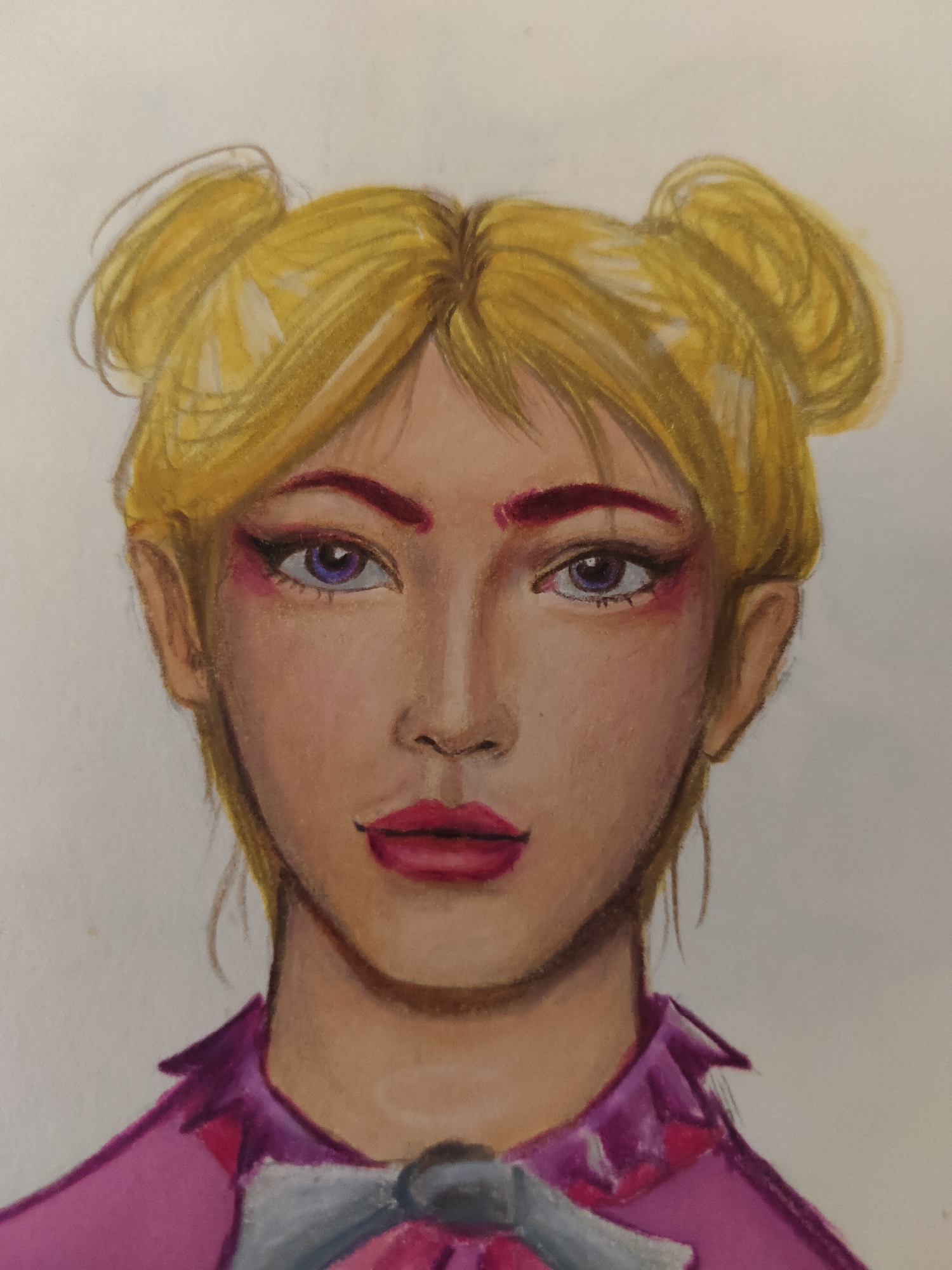 A drawing depicts the head and shoulders of a person with blonde hair styled into two high buns. The subject possesses a fair to medium skin tone with reddish-purple eyebrows and prominent winged black eyeliner. The eyes are a deep purple-violet, accented with pink/reddish eyeshadow beneath the lower lash line. Lips are full and colored a vibrant reddish-pink with a darker outline. The person wears a magenta collared garment, possibly a shirt or jacket, with a grey, possibly ruffled, element at the neck secured by a dark, circular clasp or button. The background is an unadorned light cream color. The image is a static portrait, executed with visible strokes suggestive of colored pencil or pastel medium, located in Unknown, Unknown.