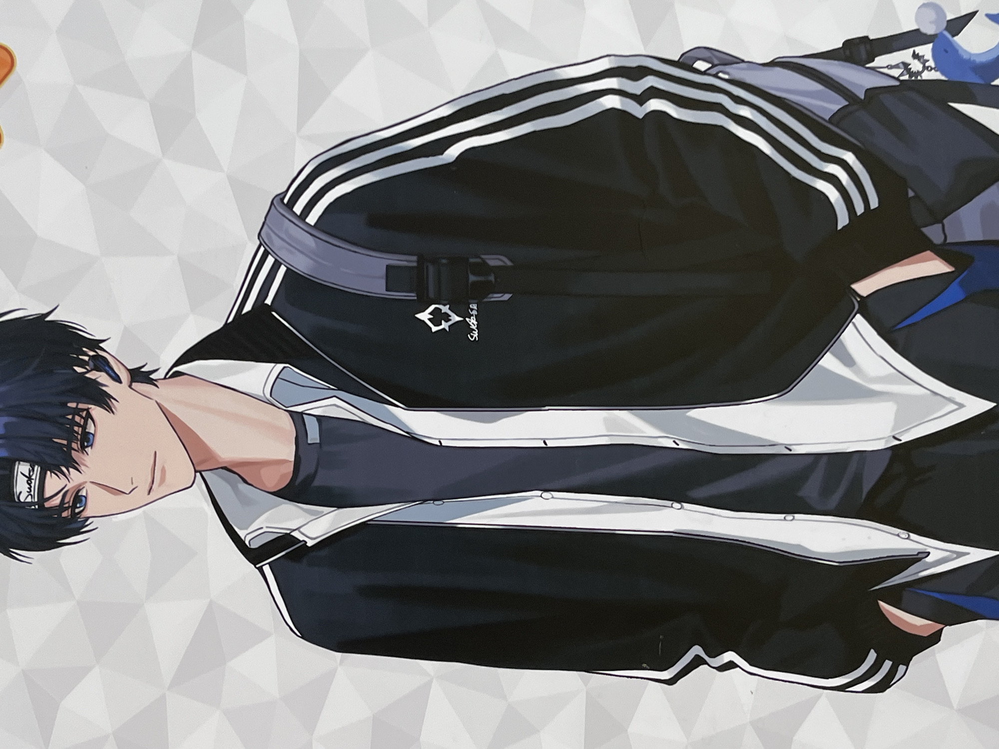This is a full-body, chest-up, digital illustration of an anime-style young man. He has dark hair, blue eyes, and wears a black and white athletic jacket over a dark t-shirt. A gray backpack with a blue dolphin charm is slung over his right shoulder. The background is a white geometric pattern. The image does not contain any information that would allow it to be placed in Yuzhong District, China.