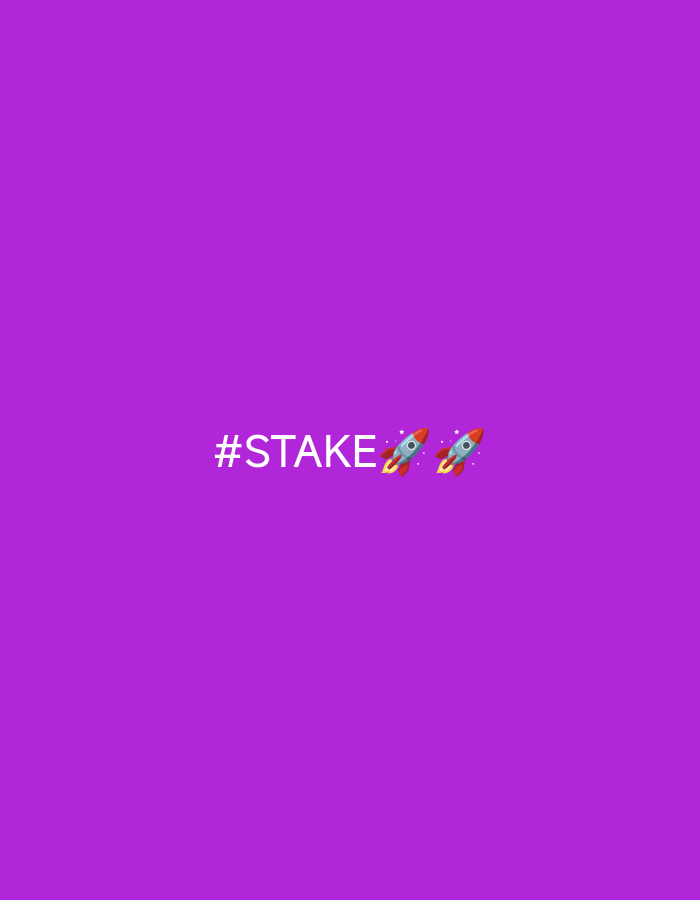 A still image features the text "#STAKE" in white, centered horizontally and positioned in the lower-middle section of a solid purple background. To the right of the text, two rocket emojis are displayed, also in the lower-middle section. One rocket is slightly above and to the left of the other. The image does not contain any information about the city of Jobokuto, Indonesia, nor does it depict any people, actions, or interactions.
