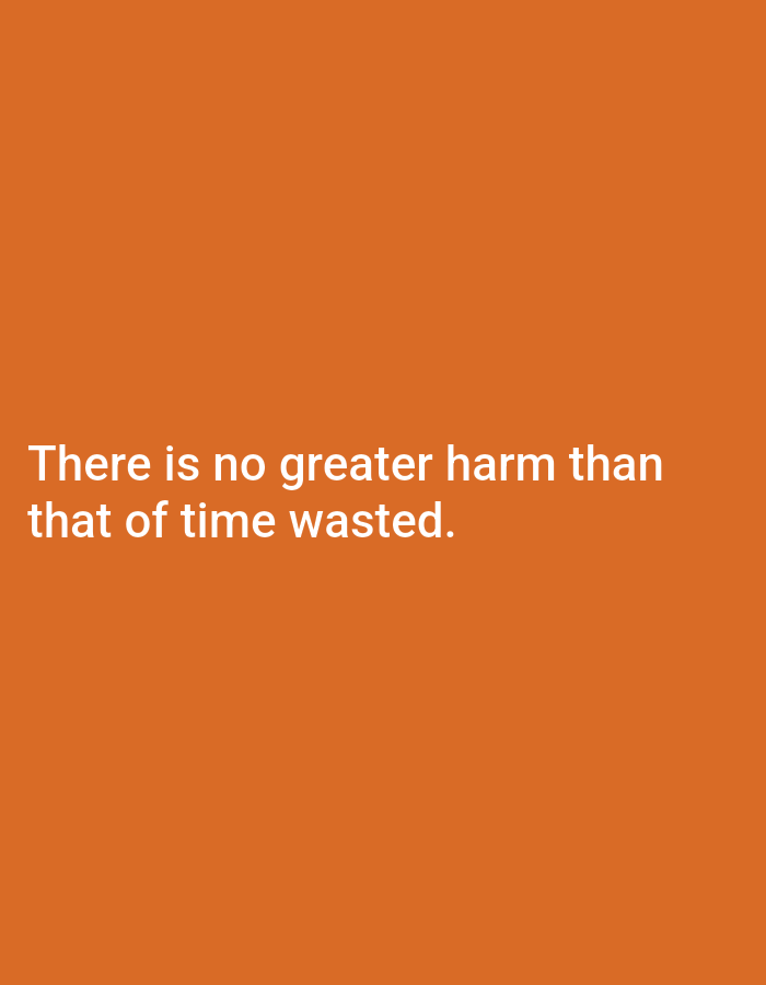 The image is a photograph with a solid orange background. White text is overlaid on the bottom half of the image, reading: "There is no greater harm than that of time wasted." There is no visible information about the city of Yamunanagar, India, nor any people, subjects, objects, actions, interactions, or environmental details that could be linked to a specific location.