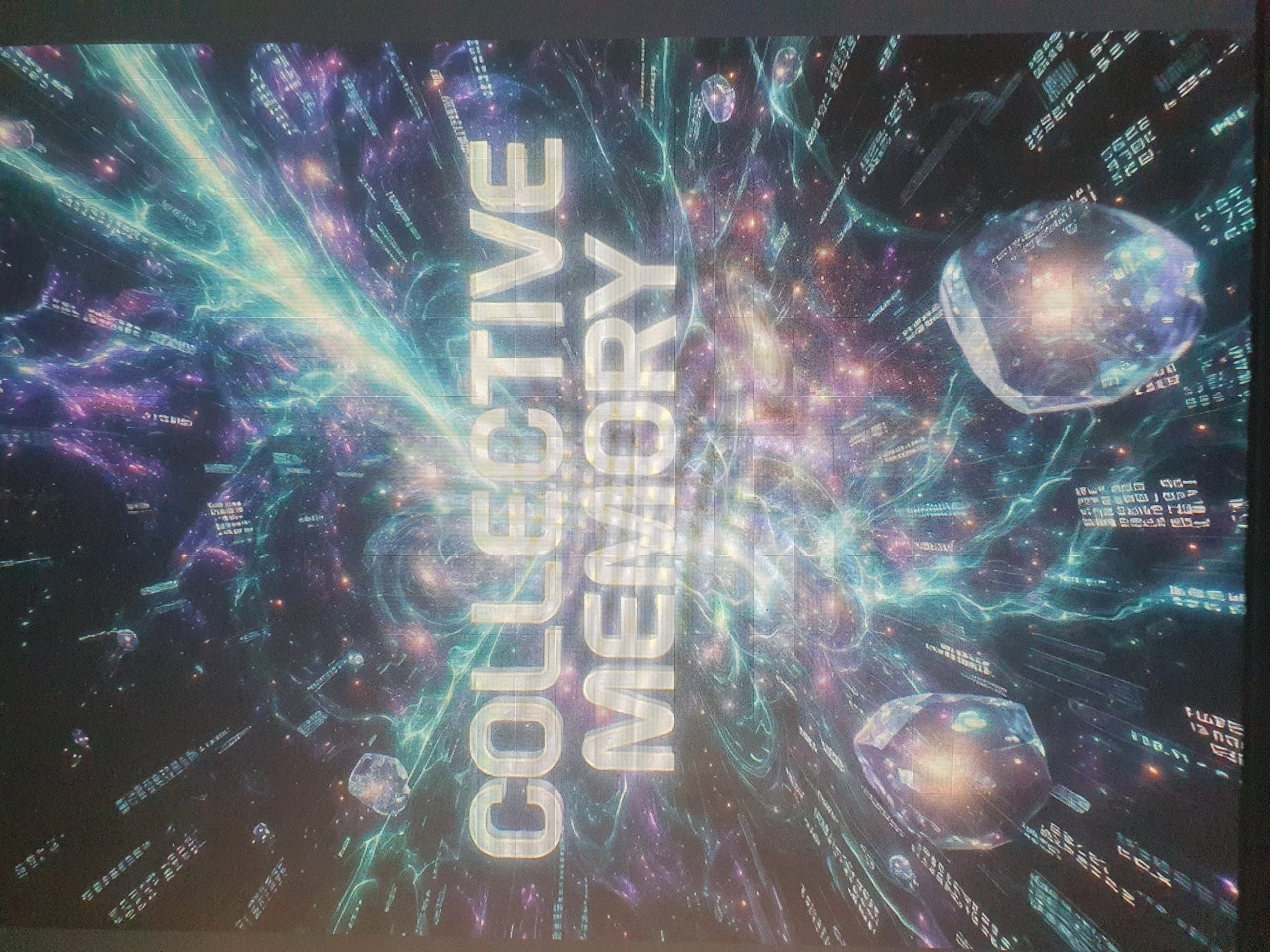 The image displays a digitally rendered, abstract scene with a cosmic or futuristic aesthetic. Large, glowing text in the center reads "COLLECTIVE MEMORY" in white capital letters. The background is filled with swirling patterns of light in shades of blue, purple, and yellow, suggesting energy or a galaxy. Scattered throughout the scene are geometric, crystalline objects that appear to be floating. The overall impression is one of an expansive, ethereal, and technologically advanced environment. There is no discernible location in Tashkent, Uzbekistan, or any real-world city, visible in this image. The scene is entirely artificial and conceptual.