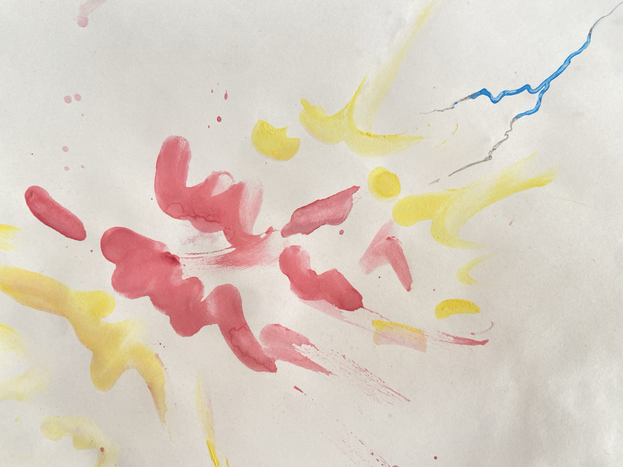 This is a close-up, abstract photograph of a watercolor painting on a white paper surface. The painting features a dynamic composition of free-form brushstrokes and splatters in various shades of pink, yellow, and a touch of blue and gray.
The subjects are purely abstract forms created by the paint. There are no discernible people, objects, or a specific scene. The setting is the white paper itself, which shows some texture and slight discoloration, suggesting it's a medium weight paper.
The activity taking place is the act of painting, captured in the fluidity of the watercolor. There is no specific event depicted.
Notable details include the varying opacity of the paint, with some areas appearing translucent and others more solid. The brushstrokes range from broad, sweeping gestures to delicate splatters and thin lines. The blue and gray lines in the upper right portion of the image appear sharper and more deliberate compared to the softer, more organic shapes of the pink and yellow. There is no indication of time of day, weather, or specific location cues beyond the abstract nature of the artwork. The emotions conveyed are open to interpretation, but the energetic and somewhat chaotic nature of the strokes could suggest dynamism, spontaneity, or even a playful mood.
There is no visible text in the image. The location context of Krasnodar, Russia, does not have any visible bearing on the abstract content of the image itself.