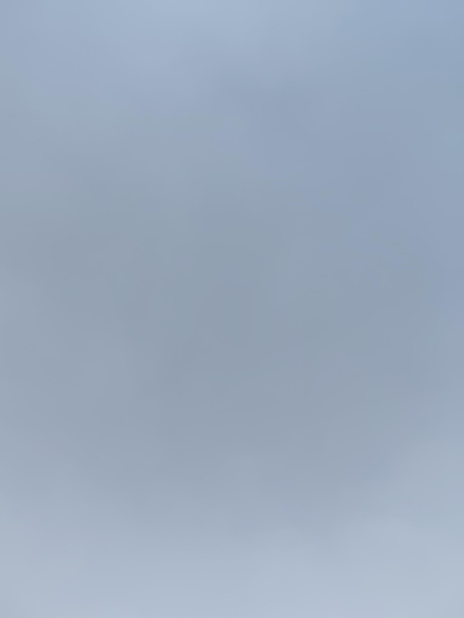 The image is a flat, uniform, pale blue background with no discernible features or subjects. It appears to be an abstract representation of a sky or a plain, undetailed surface. There are no objects, people, actions, or interactions visible. The image does not provide any information that could be used to identify a location in Dushanbe, Tajikistan, or any other specific place.