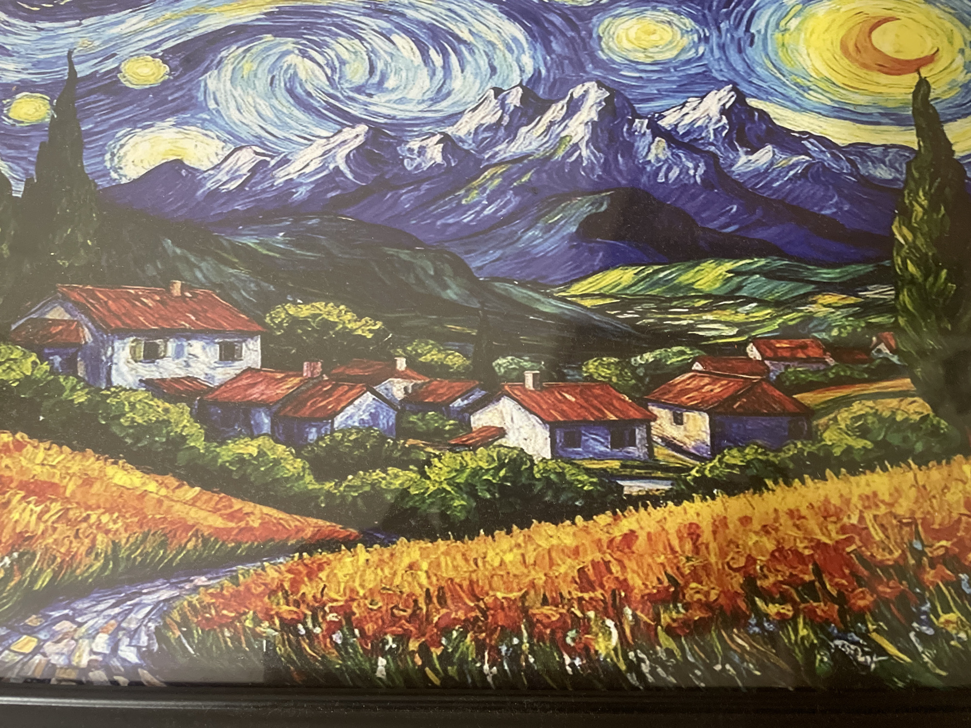 The image is a depiction of Vincent van Gogh's "The Starry Night" with a landscape featuring a village with houses with red roofs and white walls. Mountains are in the background. A swirling night sky with stars and a crescent moon dominates the upper portion of the image. The location is not Dhaka, Bangladesh.
