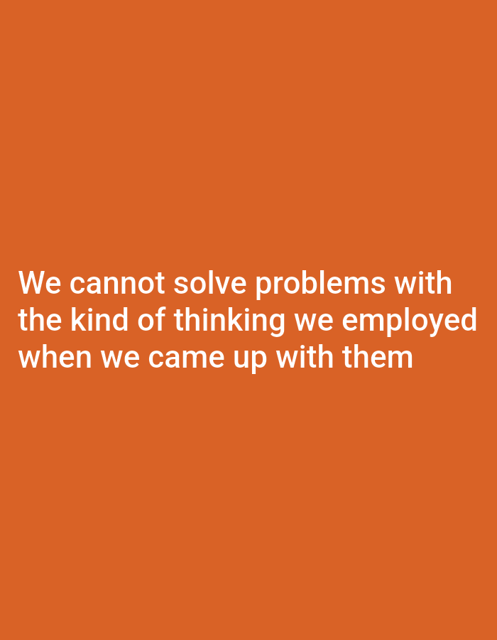 The image shows white text on an orange background. The text reads, "We cannot solve problems with the kind of thinking we employed when we came up with them." There is no information in the image to suggest any connection to Dogon Dinia, Nigeria.