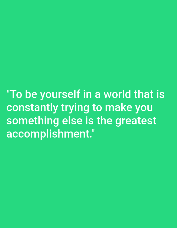 The image is a quote on a plain green background. The quote reads: "To be yourself in a world that is constantly trying to make you something else is the greatest accomplishment." There are no people, objects, or discernible environmental features in the image beyond the text and background. There is no information that would allow for an assessment of its location in Nowa Wieś Książęca, Poland.