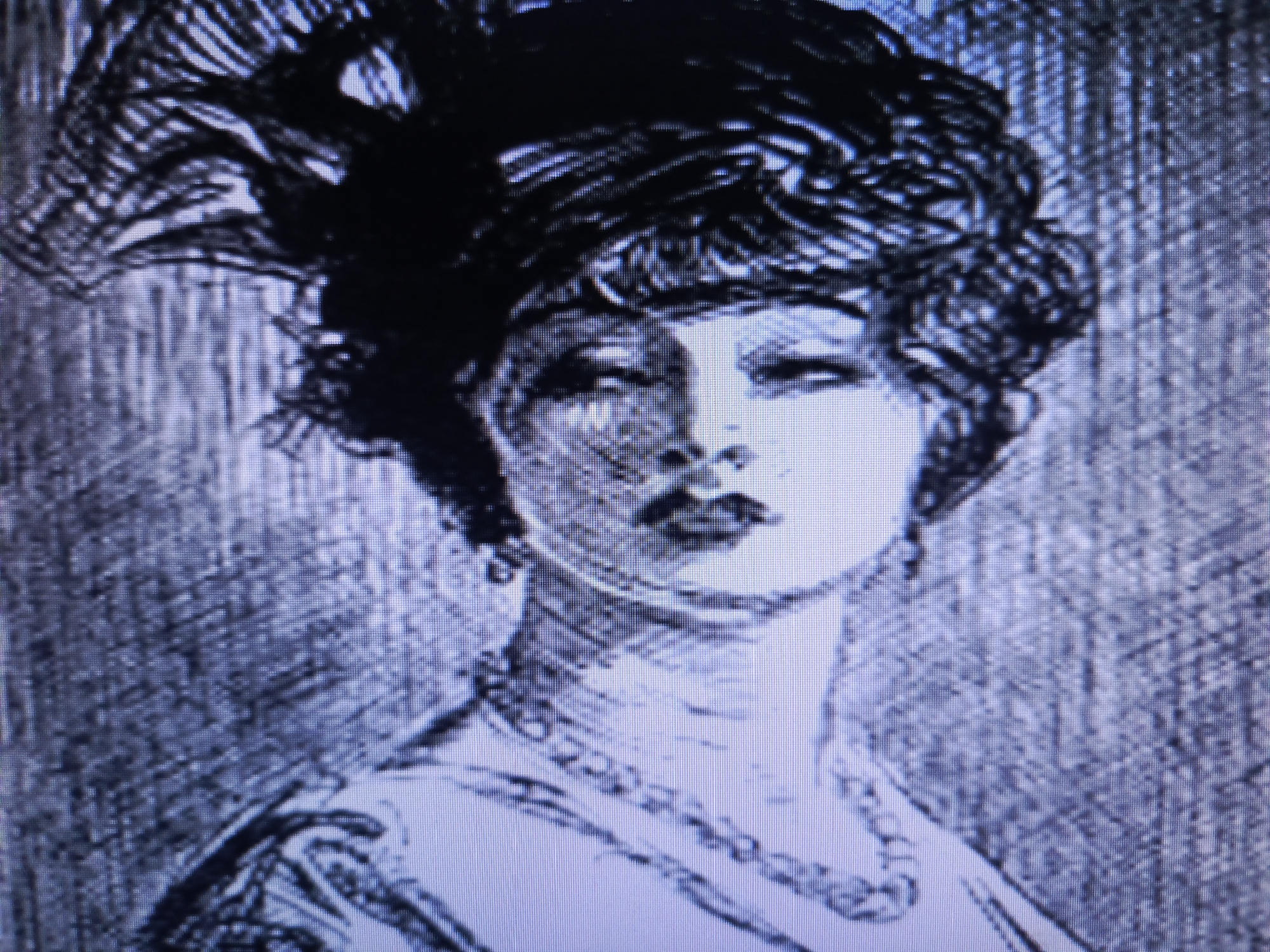 The image is a monochrome portrait of a woman, likely an illustration or sketch. She is wearing an elaborate headpiece with feathers and a pearl necklace. Her hair is styled in short, wavy curls. She has a neutral expression. The background is a textured, gradient gray. No location is discernible.