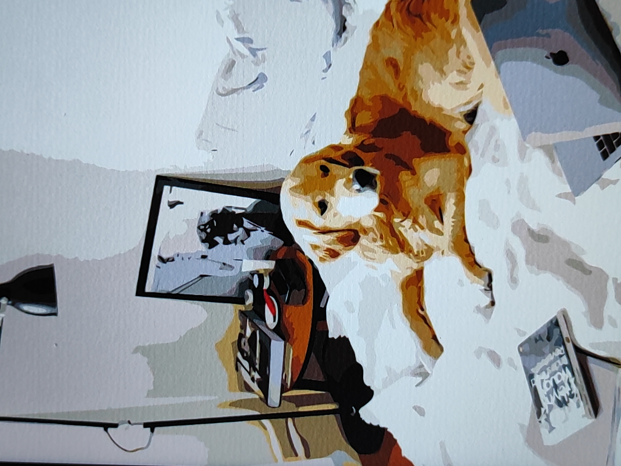 The image depicts an artistic representation, possibly a painting or digital illustration, of a domestic scene. The dominant subject is a light brown dog, positioned centrally and appearing to be lying down or resting. To the left of the dog, a black desk lamp with a silver base is visible, casting a shadow. Below the lamp and to the left of the dog, a framed picture or photograph is displayed, showing a scene with what appears to be a person and a vehicle. Further to the right of the dog, a laptop computer with a silver casing and keyboard is open and partially obscured by the dog. In the lower right corner, a tablet device with a patterned cover is standing upright. The background is predominantly white with subtle shading, suggesting a flat surface or wall. The style of the image is characterized by distinct blocks of color and simplified shapes, giving it a somewhat abstract or stylized appearance. The scene is indoors, likely a home or office environment. There is no indication of the city of Fergana, Uzbekistan, within the image itself.