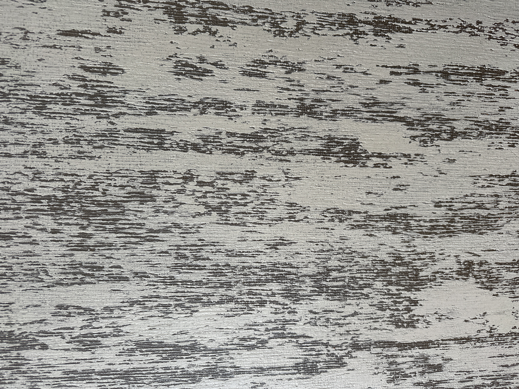 The image shows a close-up, abstract view of a textured surface. The texture appears to be wood grain with a distressed white wash or paint effect. Vertical lines of dark brown or gray are interspersed with areas of lighter, chipped or worn white material. There are no people, objects, or environmental details visible that would indicate a specific location in the city of Yessentuki, Russia, or any other location. The image is purely a textural study.