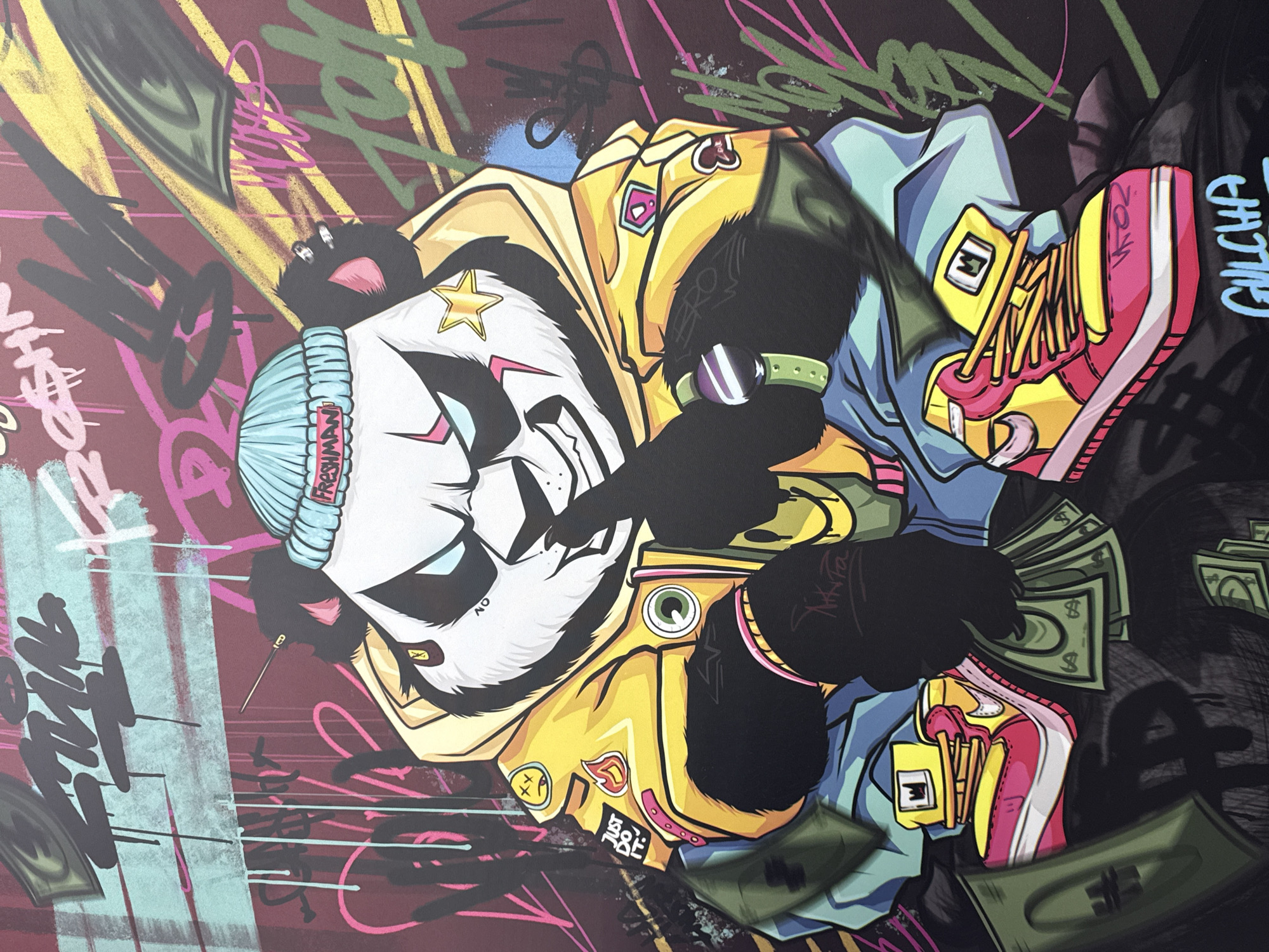 A graffiti-style illustration features a panda character wearing a blue beanie, a yellow jacket, blue pants, and pink and yellow sneakers. The panda is depicted with black fur and a white face marked with stylized features. A gold star is located on the panda's forehead. The panda holds wads of green money in its black paws. The background includes pink, green, and black graffiti markings. "GULCHIA" is written in turquoise on the right-hand side. The style is cartoonish and urban. There is no information on the location of this image being Chaikovsky, Russia, in the current information.