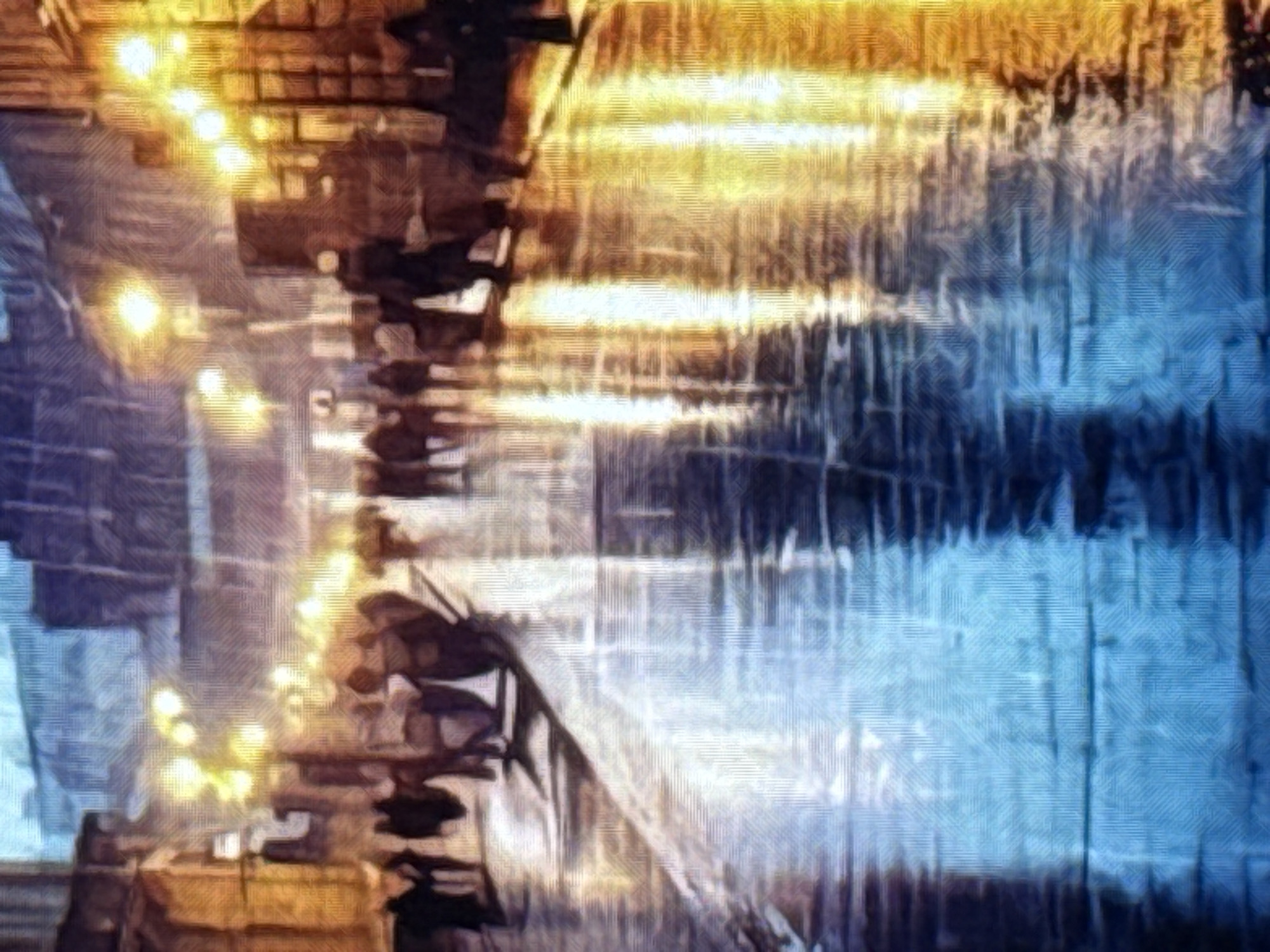A street scene is depicted in a painterly style, possibly an Impressionist interpretation of a European city at night, with a focus on the reflections on a wet street. The perspective is from street level, looking down a cobblestone street lined with buildings. Yellow streetlights and building lights create bright reflections on the wet pavement, which is rendered in blues and yellows. Silhouettes of people are visible walking on the street and sidewalks, some appearing to be in groups. The architectural style suggests older buildings with multi-story facades, some with visible windows and doorways. The overall atmosphere is moody and atmospheric, emphasizing the interplay of light and shadow on a rainy evening.