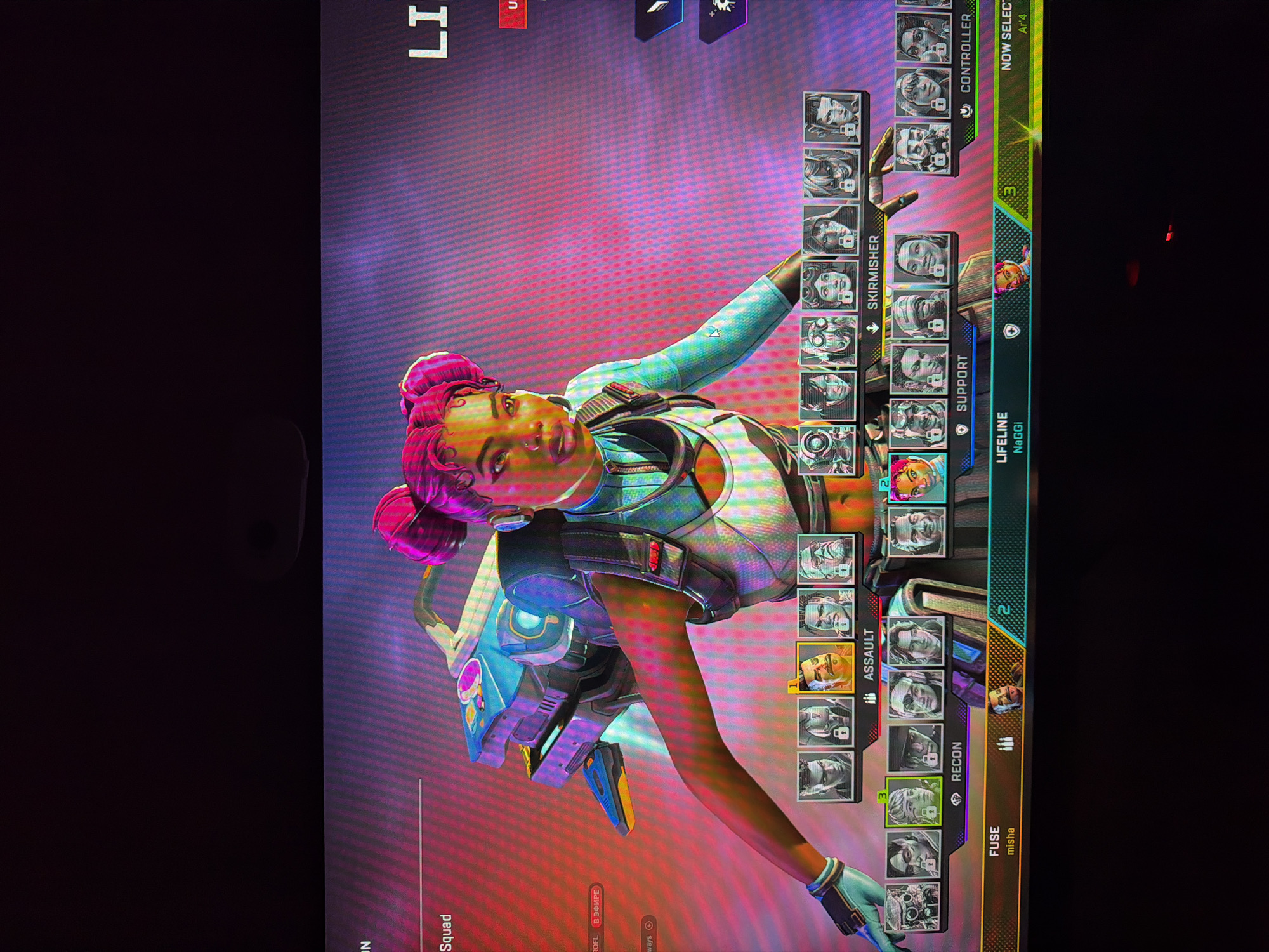 The image shows a screen capture of the character selection screen from the video game "Apex Legends." The screen displays a user interface with various playable characters, categorized by class: Recon, Assault, Skirmisher, Support, and Controller. The selected characters are Lifeline, Fuse, and an unselected character. The usernames "NaGGi" and "misha" are associated with Lifeline and Fuse, respectively. The screen indicates the teams are being formed, and the game mode is in progress as shown in Russian text. The location is not visible in the image.