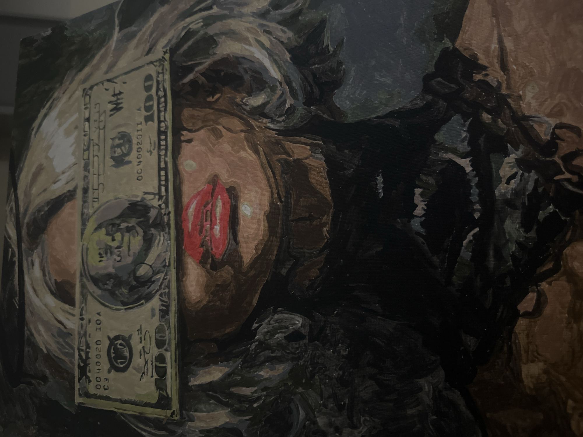 The image is a photograph of an oil or acrylic painting, featuring a stylized close-up of a person's face. A representation of a $100 bill is depicted lying horizontally across the upper part of the face, obscuring the eyes. Below the bill, prominent red lips are visible, set against a brown or tan skin tone. The person's hair, rendered with visible brushstrokes in dark shades of black, brown, and grey, frames the face. The background of the painting is abstract and dark, composed of shadowy tones.
The painting style is expressive, characterized by distinct brushstrokes that add texture and depth, particularly in the hair and background. The overall color scheme is predominantly dark, with the bright red of the lips and the pale green/beige of the dollar bill providing strong contrasts.
On the painted $100 bill, several details are legible: the number "100" is visible at the top right, a serial number "OC4002011A" is clearly seen, and "C3" is visible near the bottom left. A stylized portrait, resembling Benjamin Franklin, is also discernible on the bill. The painting conveys a theme possibly related to materialism or being influenced by money, given the deliberate placement of the bill over the eyes. The photograph itself is taken at an oblique angle, highlighting the textured surface of the artwork. No specific location or time of day is indicated.