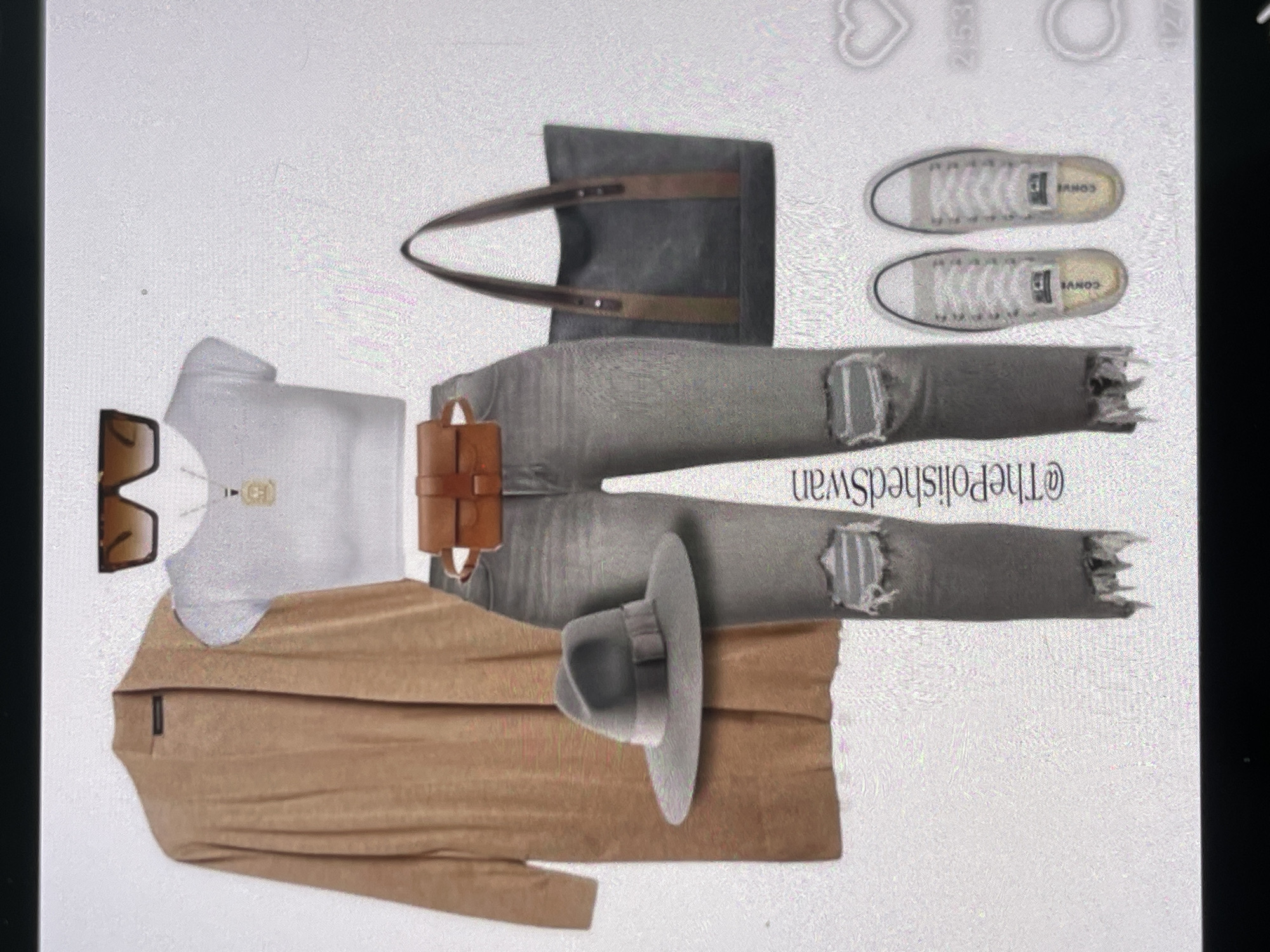 The image displays a flat lay of a casual outfit. The outfit includes a long, camel-colored open-front cardigan, a white crop top, ripped gray jeans, and a gray fedora hat. Accessories consist of large square sunglasses, a gold pendant necklace, a brown belt bag, and a dark gray tote bag with brown straps. A pair of white Converse sneakers with visible stitching and a subtle yellow sole complete the ensemble. The background is plain and white, suggesting a studio setting or a digitally created composition, and no city or environmental context is discernible.