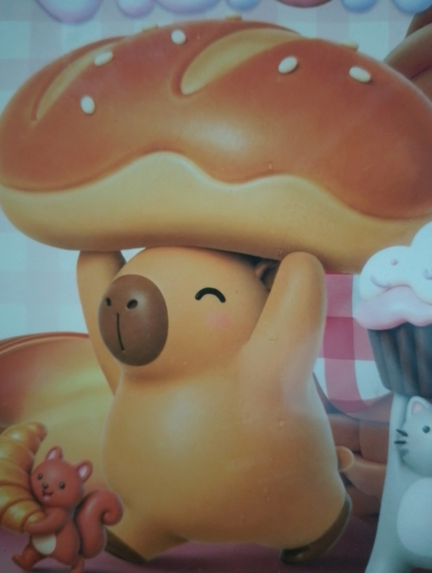 The image depicts a close-up view of a collection of cartoon-like figurines, likely part of a toy set or display. The primary subject is a large, tan-colored figurine with a rounded head and body, holding a large, brown, baguette-shaped bread item above its head. The bread has decorative white dots. The figurine has a brown circular nose with two small eye-like indentations and a small horizontal mouth, and rosy cheeks. It is positioned centrally in the frame. To the left of the main figurine, a smaller, brown squirrel figurine is visible, clutching a croissant. To the right, a pink frosted cupcake with a dark brown wrapper is depicted, partially obscured by the main figurine. Further to the right, a light gray cat figurine is standing upright. The background is a pastel-colored, abstract design, suggesting a playful or whimsical setting. The scene appears to be indoors, possibly a retail display or a private collection. There is no discernible information within the image that relates to the specific location of Kendalrejo, Indonesia.