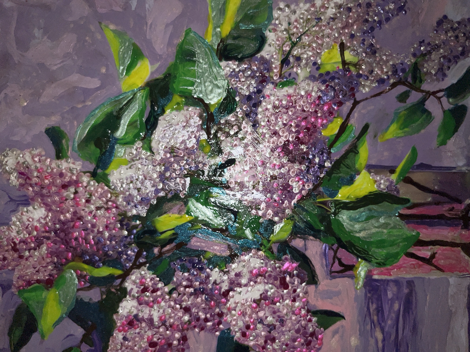 The image is a close-up of a painting featuring a bouquet of lilac flowers in a vase. The lilacs are depicted in various shades of purple and pink, with individual florets rendered with a textured, almost three-dimensional effect, possibly using impasto or a similar technique. Some florets appear to have a glittery or iridescent quality. Dark green leaves with bright yellow-green highlights are interspersed among the blossoms. The background is a soft, textured lavender color. The vase is partially visible at the bottom left, appearing to be clear glass with pink and purple reflections. The style of the painting is impressionistic, with visible brushstrokes and a focus on light and color.
There is no indication of the city of Minsk, Belarus, or any other specific geographic location in the image. The scene is a still life composition of flowers.