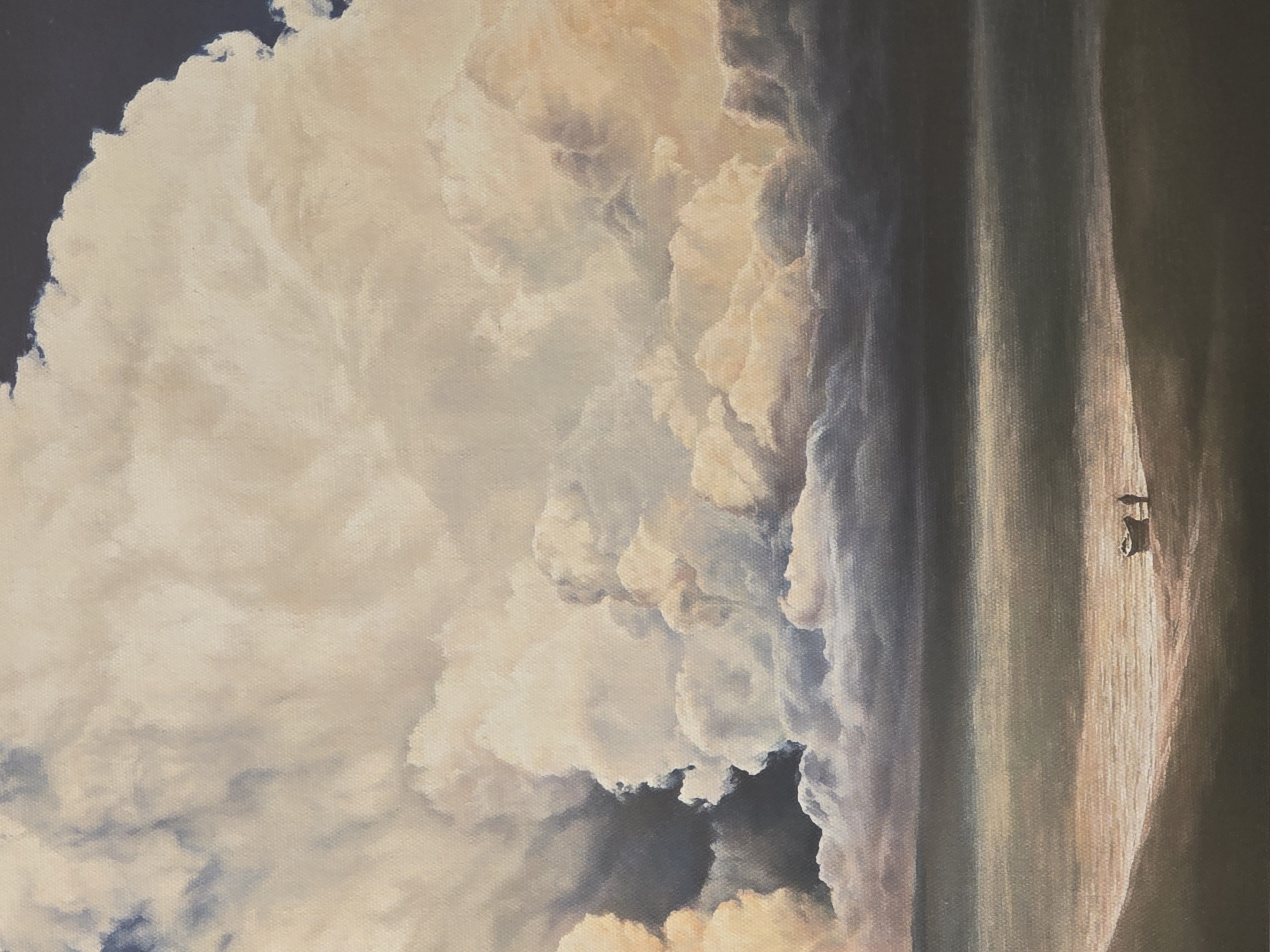 The image is a painting of a landscape featuring a large cloud formation dominating the sky. The clouds are voluminous and appear to be illuminated with soft, warm light, creating a contrast between the bright areas and the shadowed portions of the clouds. The lower part of the image shows a field or landscape feature, possibly a hill, with an indistinct object or structure visible on the right side. The scene is bathed in an overall warm, muted color palette.