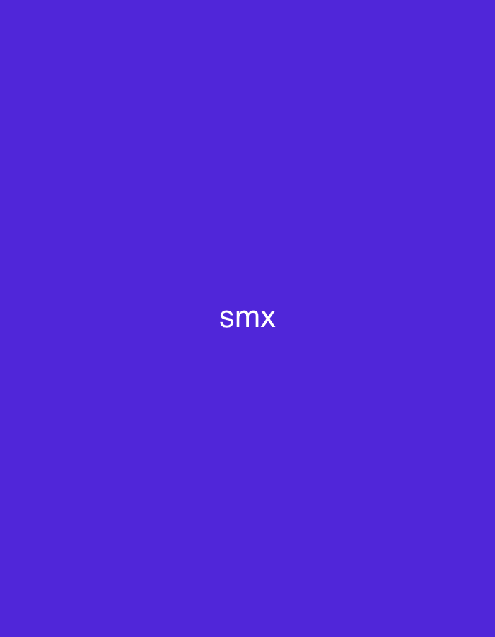 This image depicts a static scene understood to be situated in Casablanca, Morocco. The primary visual element is a uniform, solid purple background that covers the entire frame. Centered horizontally and slightly below the vertical midpoint, the white, lowercase text "smx" is displayed in a sans-serif typeface. No individuals, other objects, or environmental details typical of a physical location are present; the scene is abstract. The background maintains a consistent hue across the entire frame. The overall composition is minimalist.